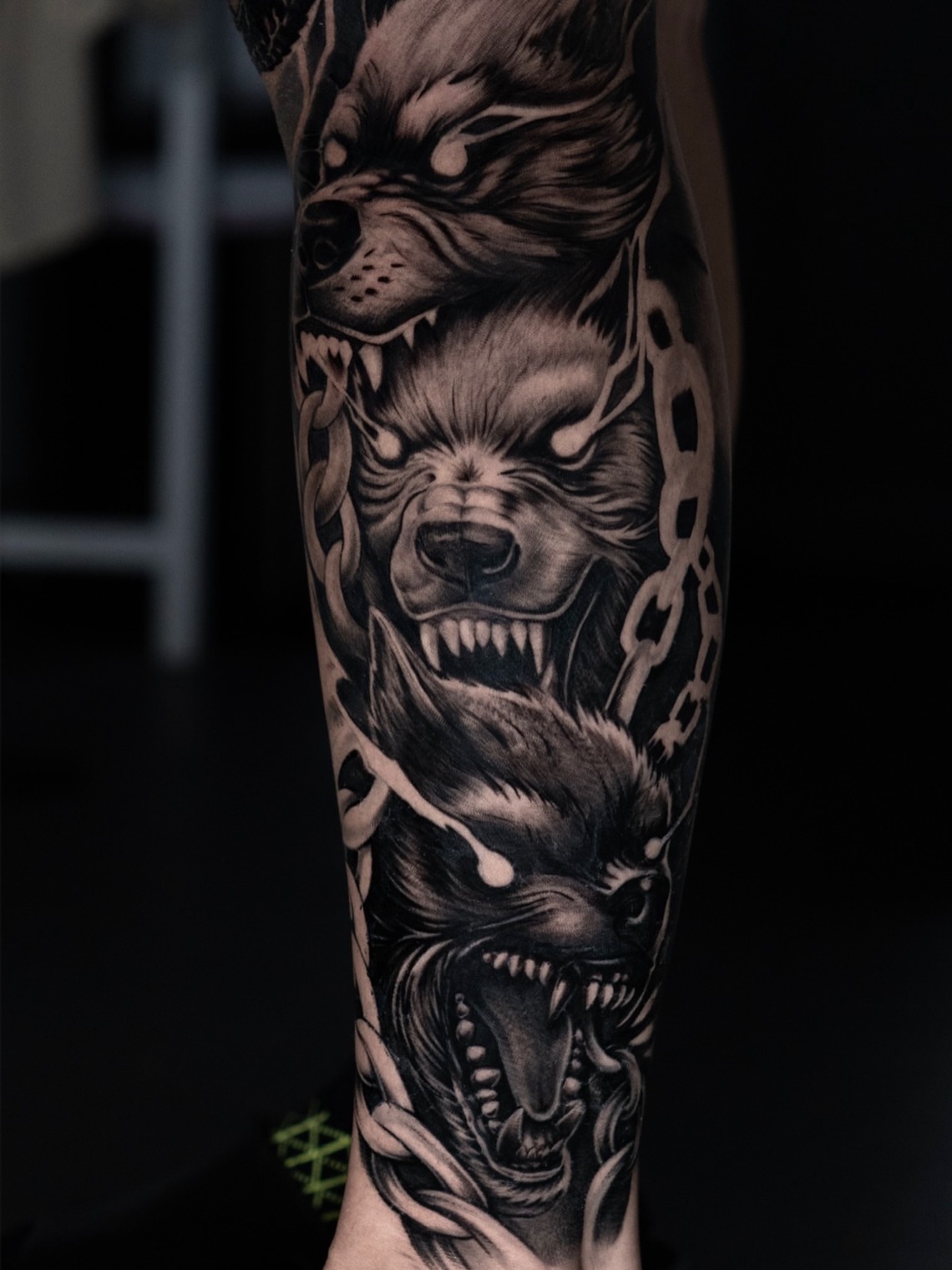 Angry wolves realism tattoo on the forearm by Angel Gonzalez