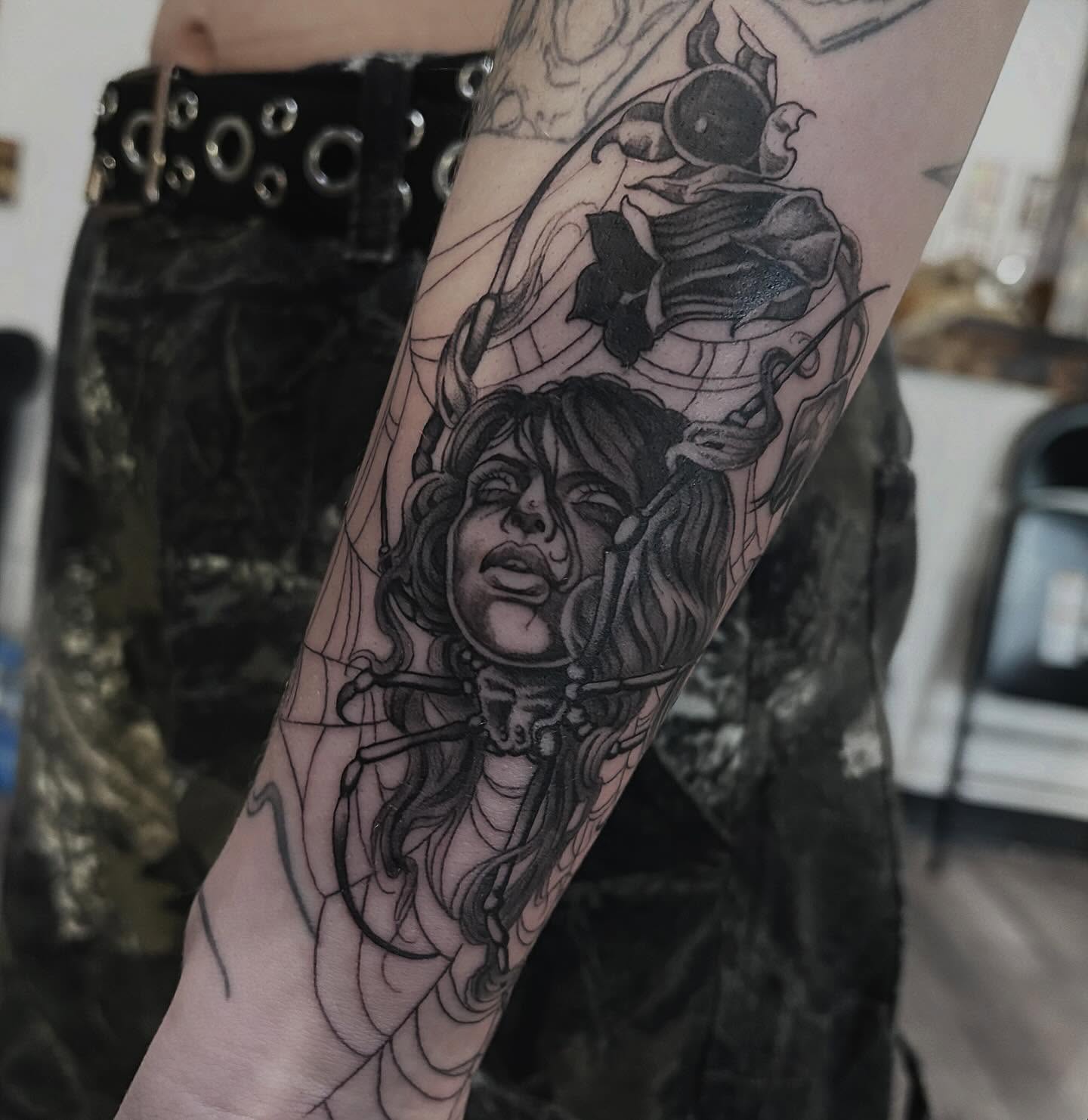 Woman with horns realism tattoo on the forearm by Tad Fulkerson, San Francisco, California