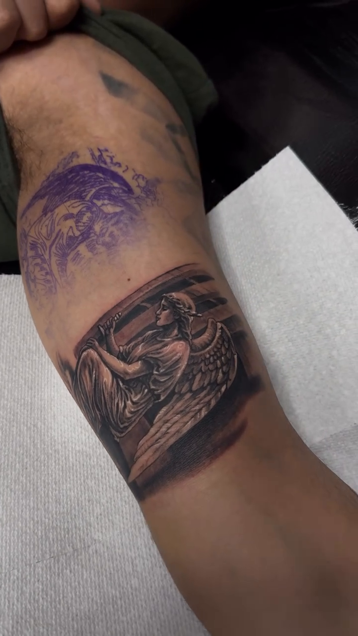 Angel with wings realism tattoo on the forearm by Tony Hernandez, Chicago, Illinois