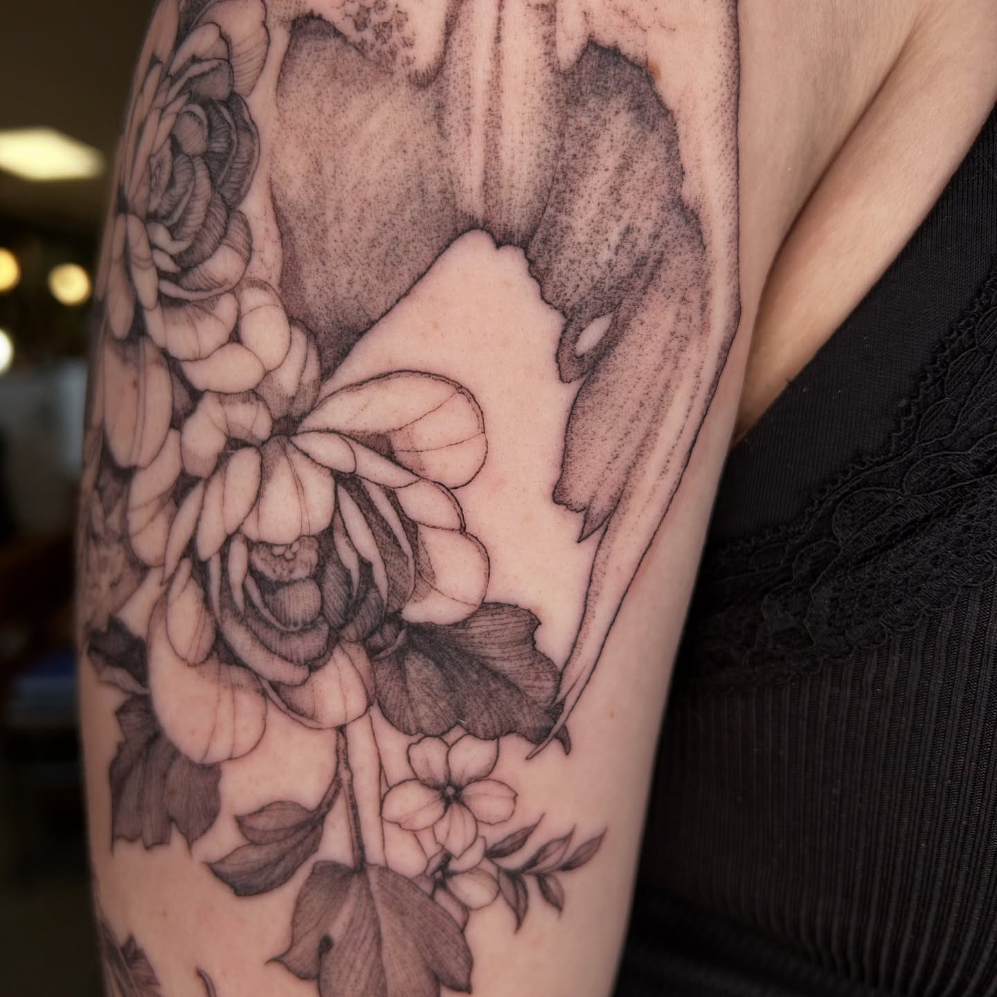 Floral bouquet realism tattoo on the forearm by Amber Miracle