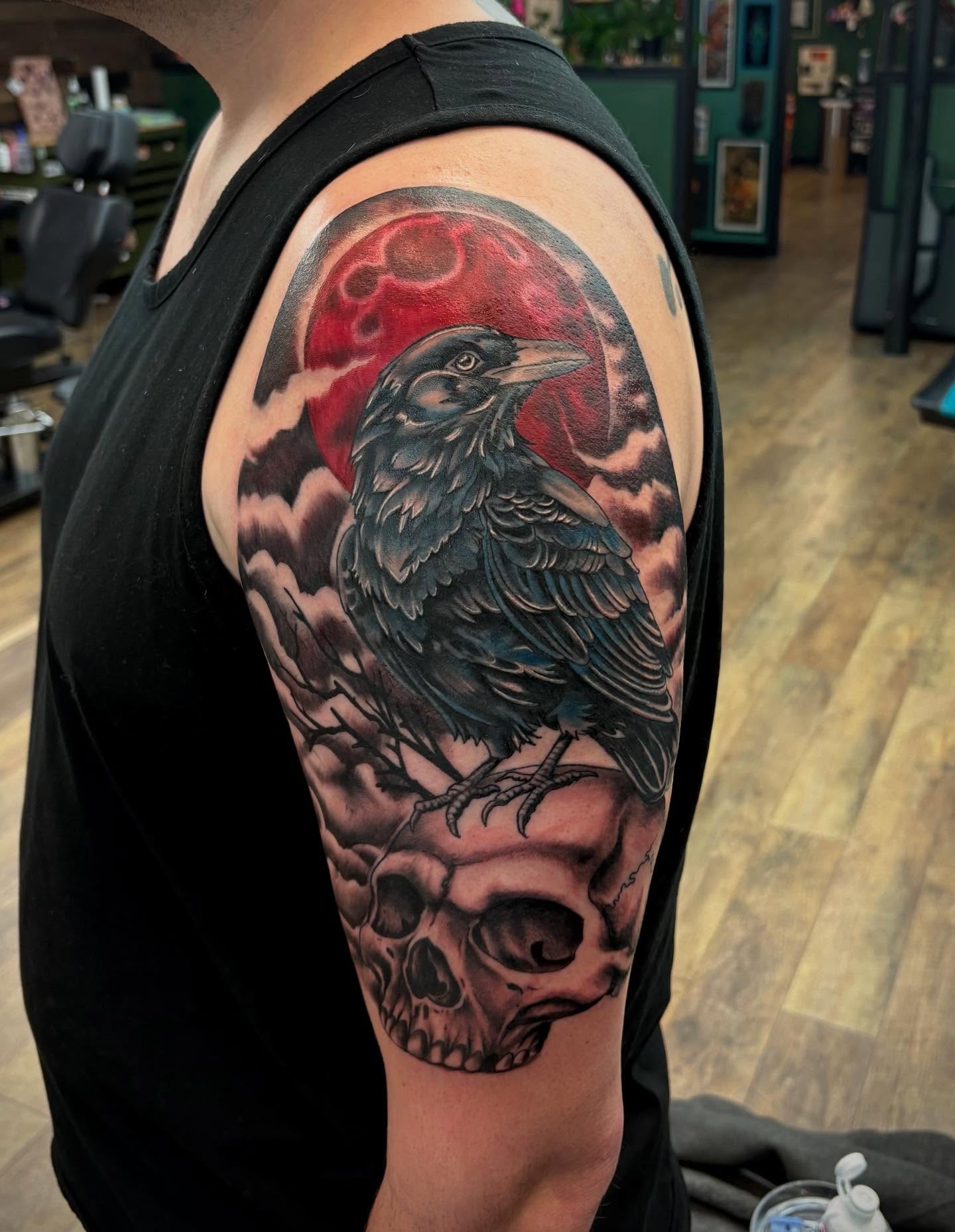 Crow and skull realism tattoo on the shoulder by Robbie Reel, Wichita, Kansas