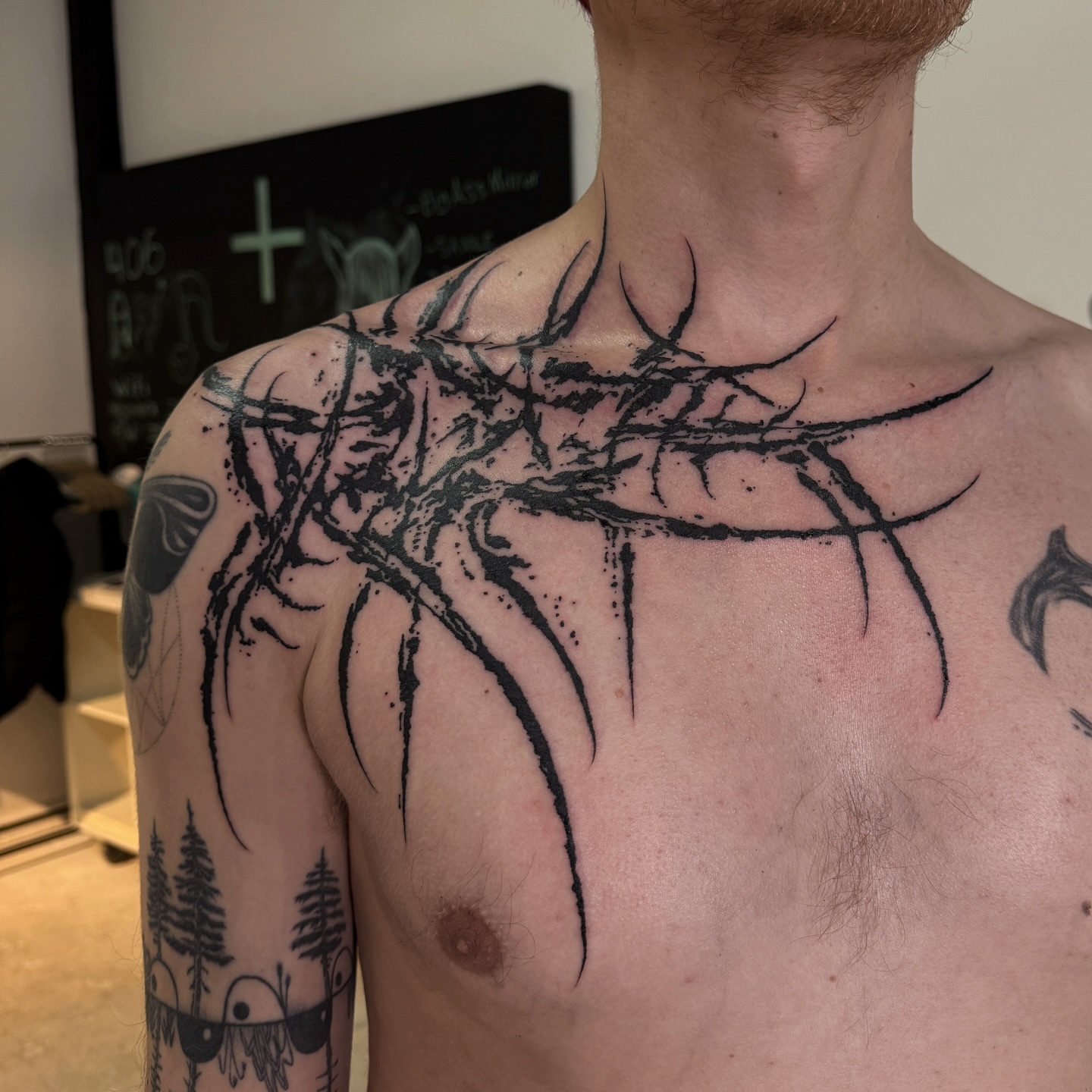 Thorn crown black and grey tattoo on the chest by Penelope