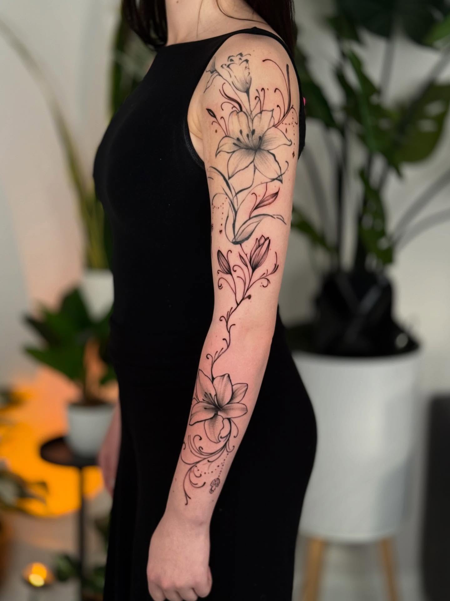 Lilies black and grey tattoo on the forearm by ♍️𝒾𝒸𝒽𝑒𝓁𝓁𝑒⁺‧₊˚ ཐི⋆♱⋆ཋྀ ˚₊‧⁺, Charlotte, North Carolina