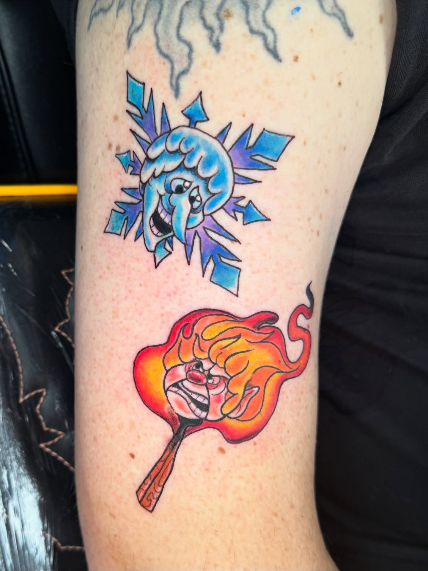 Ice and fire American traditional tattoo on the forearm by Breanna B