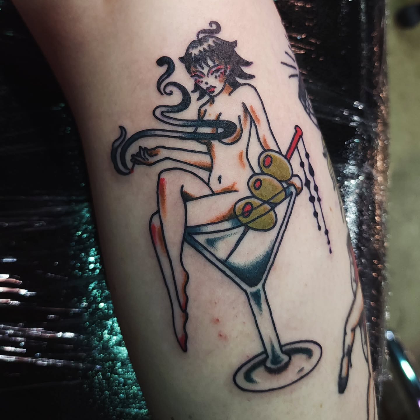 Martini girl American traditional tattoo on the forearm by Maxine Stewart