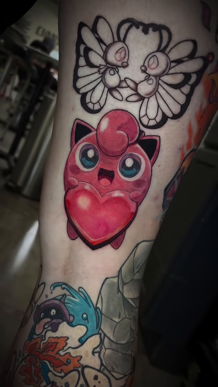 Jigglypuff holding a heart new school tattoo by Ryan Walker