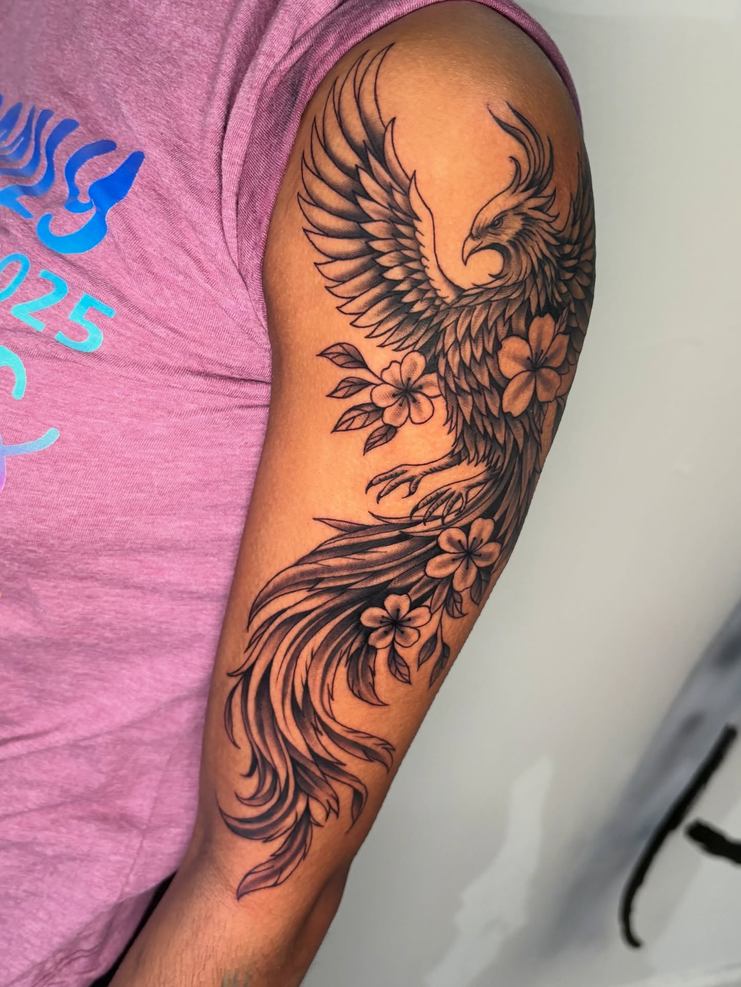 Phoenix black and grey tattoo on the forearm by Osiel Rodriguez