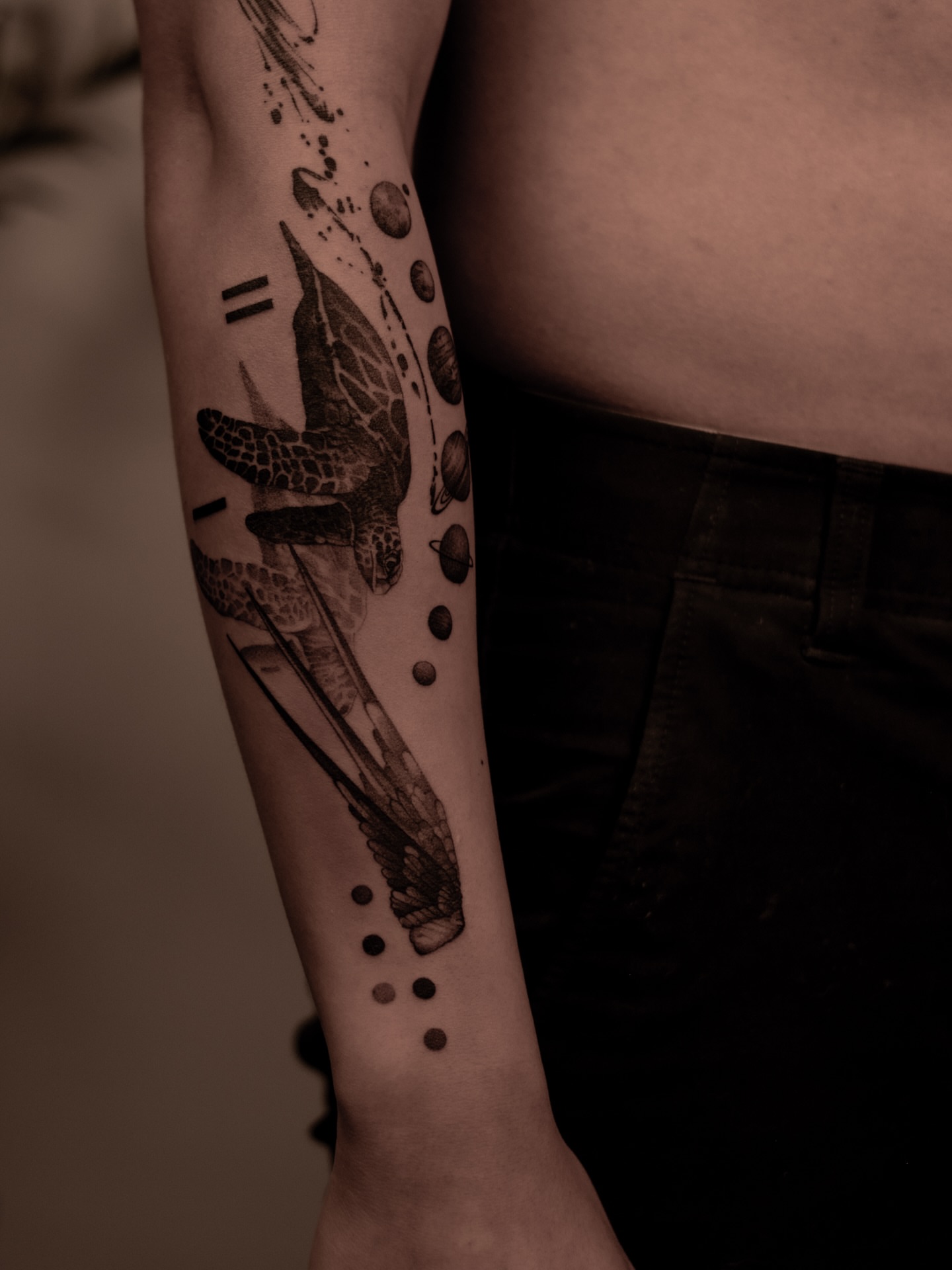 Turtle and wings dotwork tattoo on the forearm by Mark D, Los Angeles, California