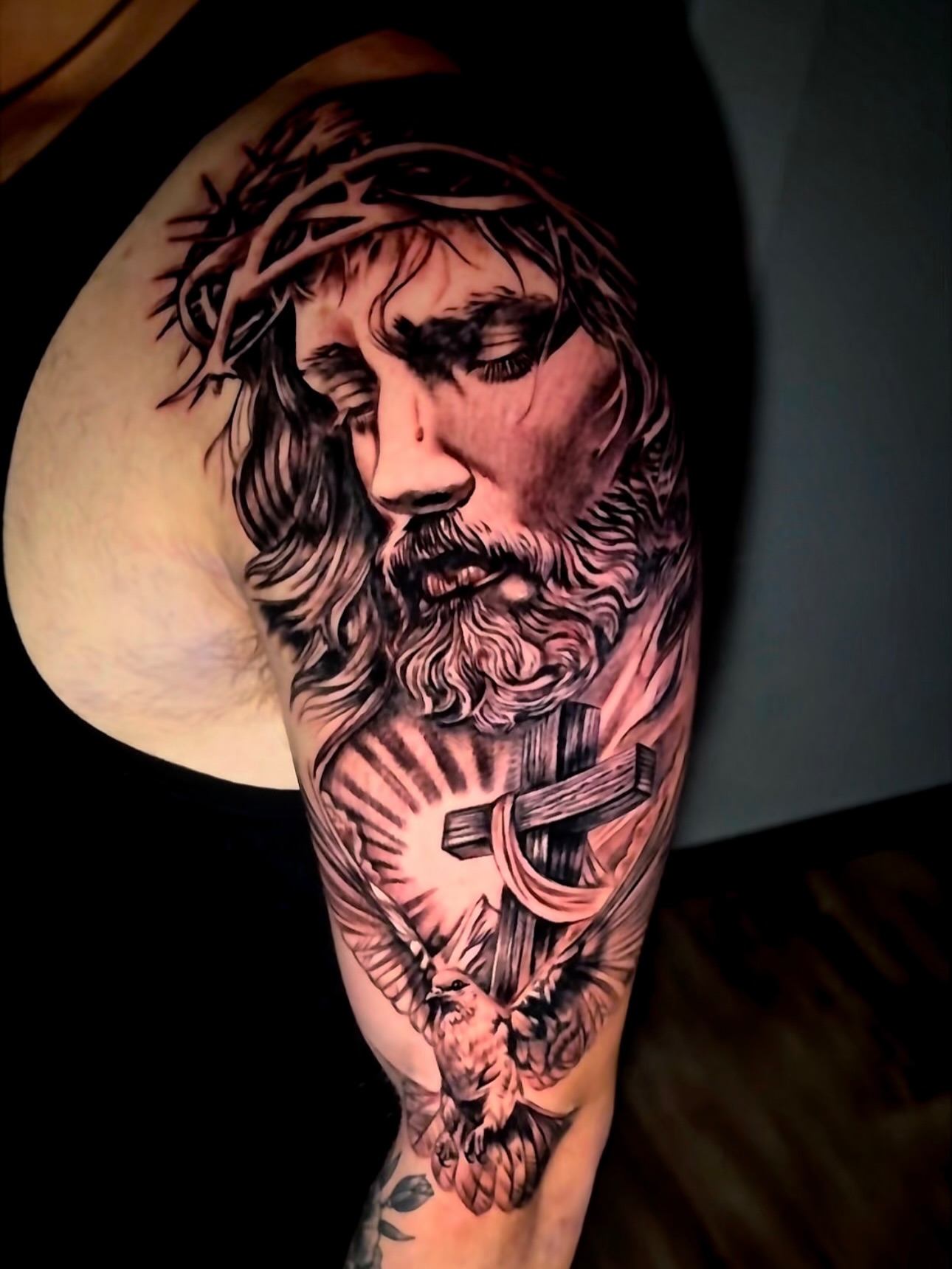 Religious figure realism tattoo on the forearm by Tampa tattoo artist