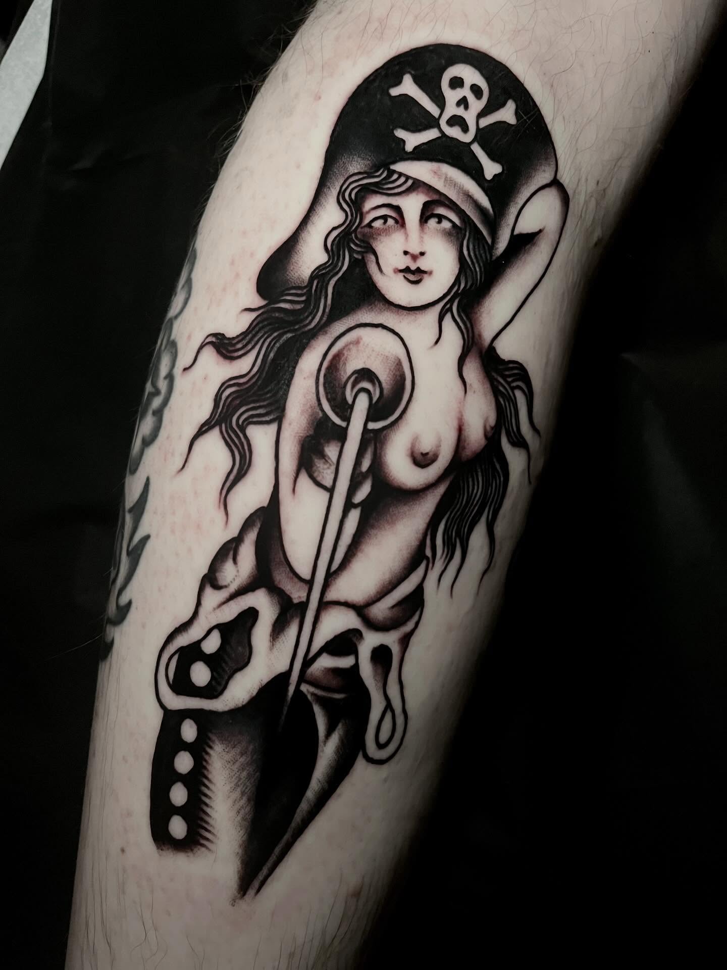 Pirate woman black and grey tattoo on the forearm by JohnJohn