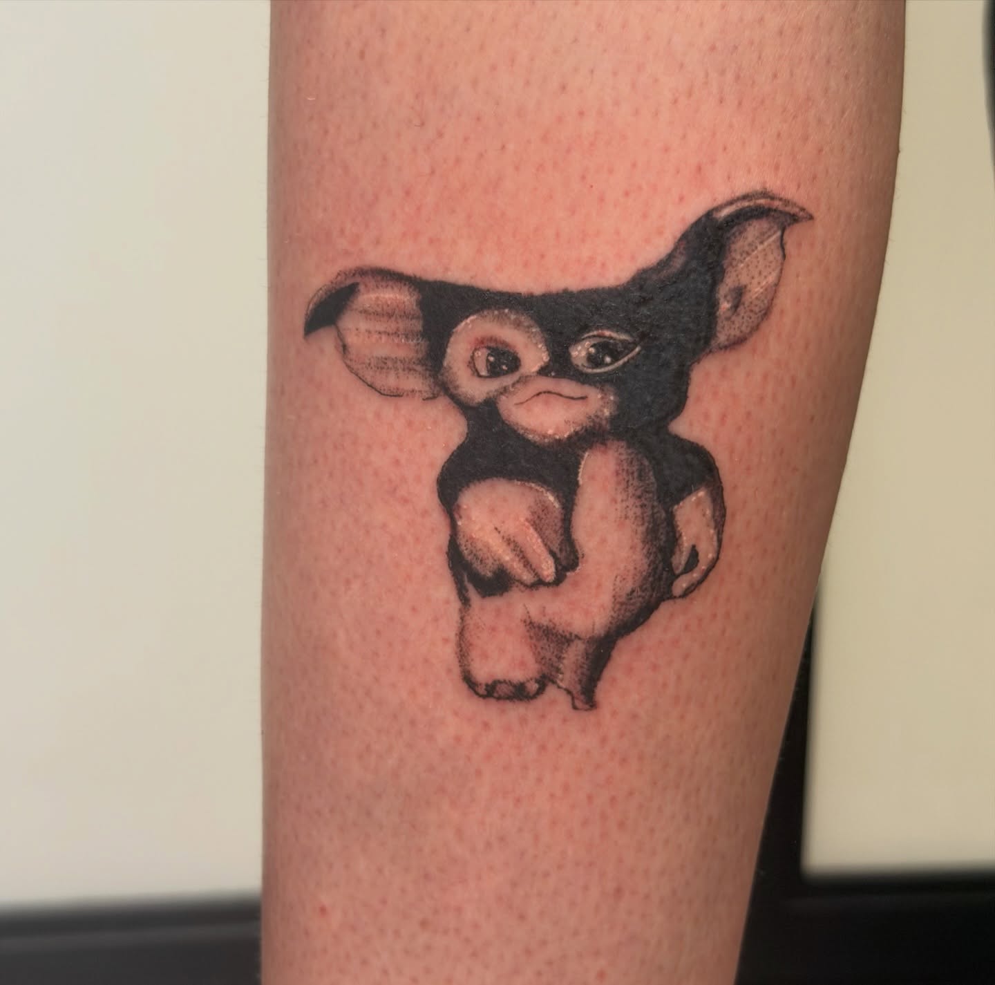 Gremlin dotwork tattoo on the forearm by Alaska