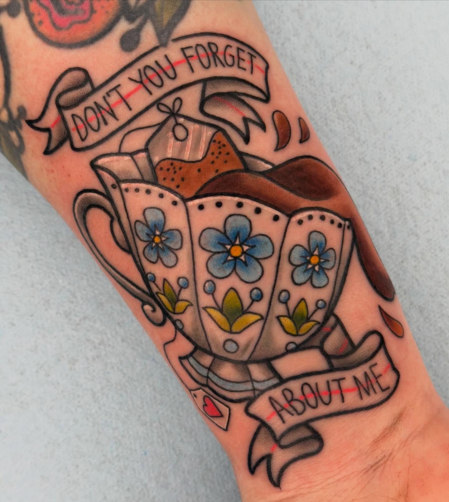 Teacup and saucer American traditional tattoo on the forearm by Beeker, Bellingham, Washington