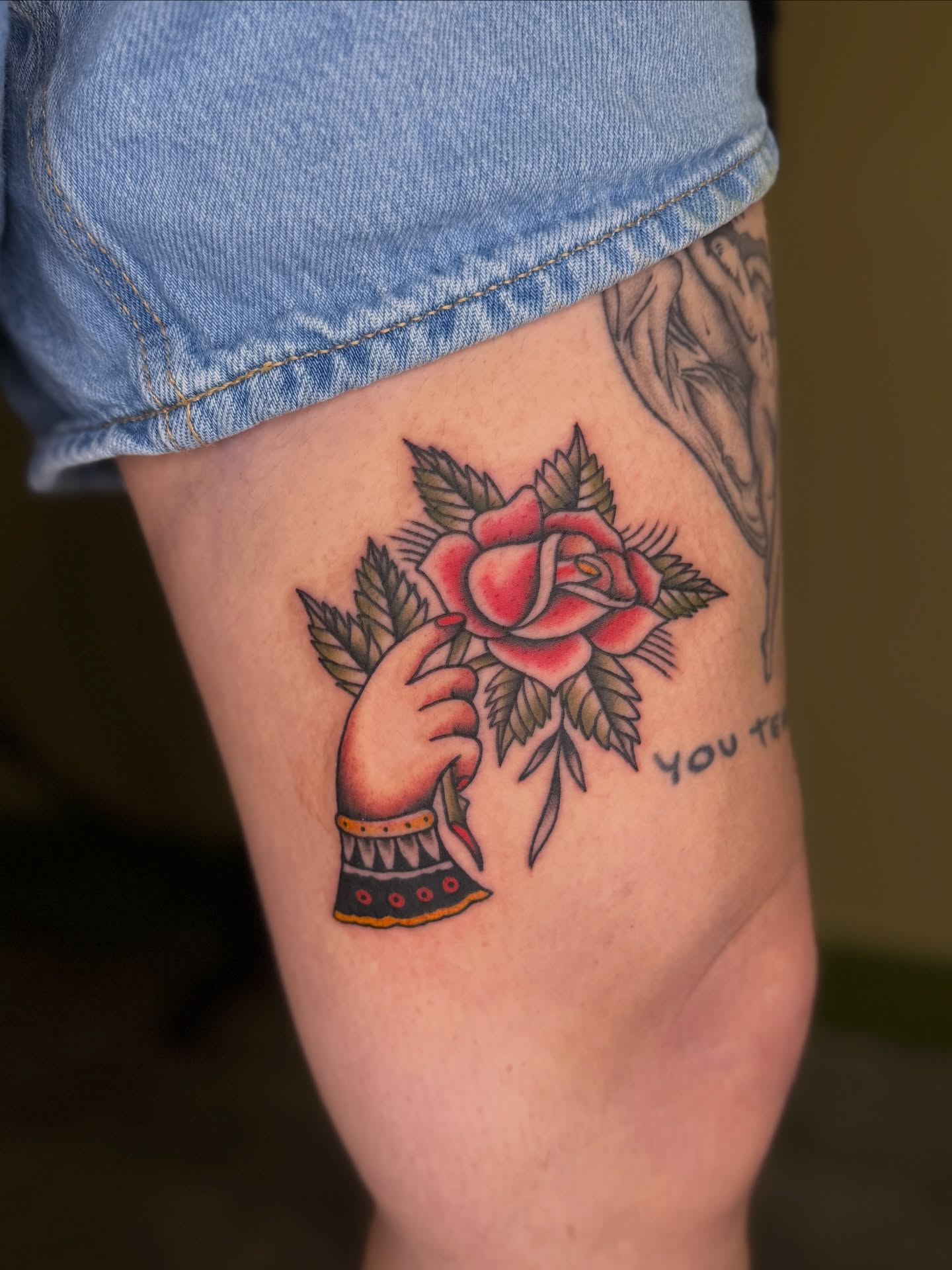 Rose and hand American traditional tattoo on the forearm by Fabian💉 Tattoo artist