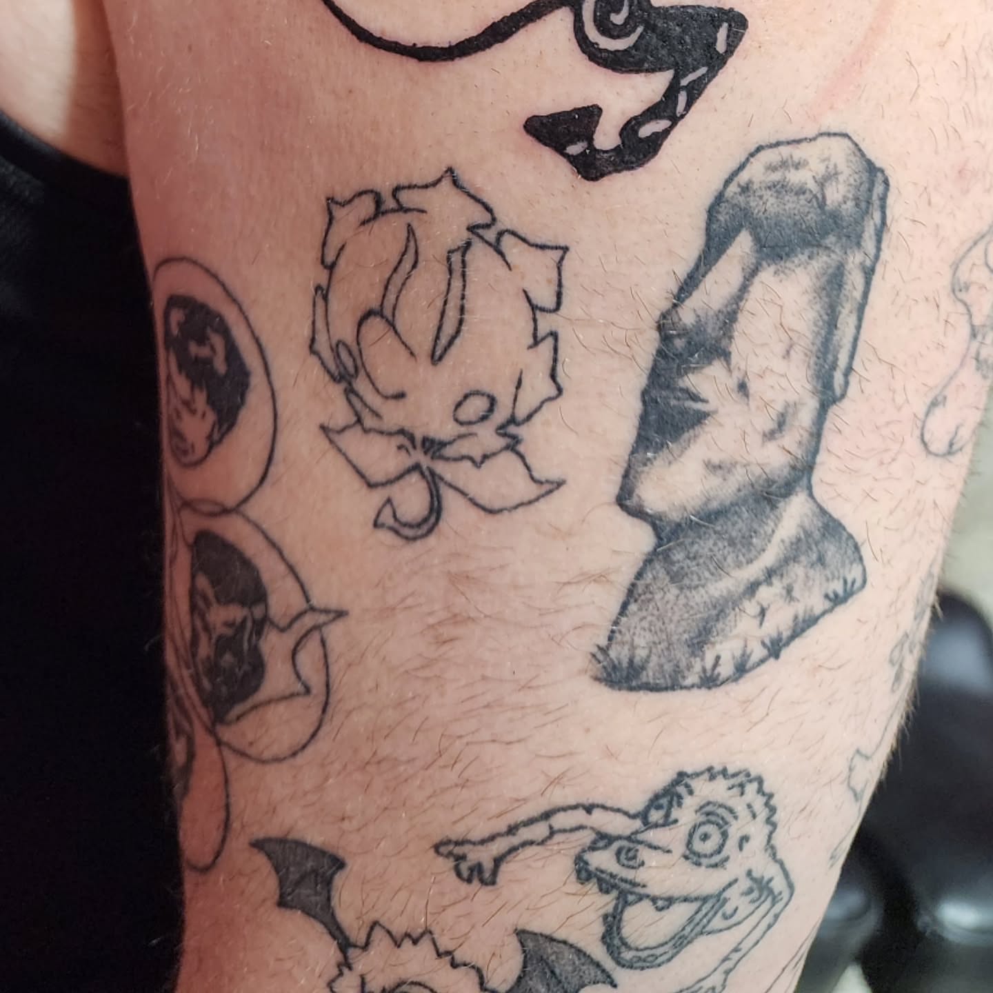 Stone statue black and grey tattoo on the forearm by K.F. Golden