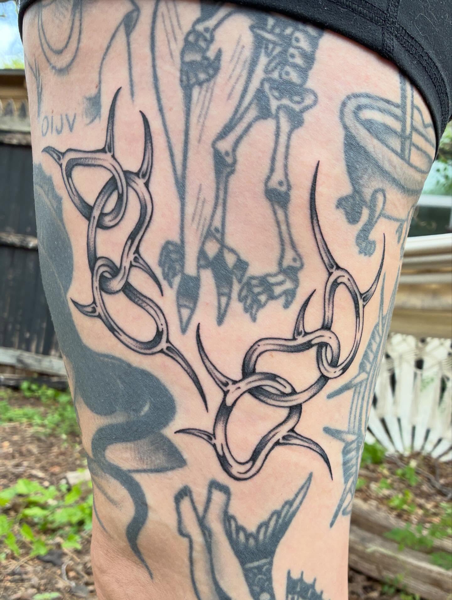 Antlers and skeleton black and grey tattoo on the thigh by Steven Sessler, San Francisco, California
