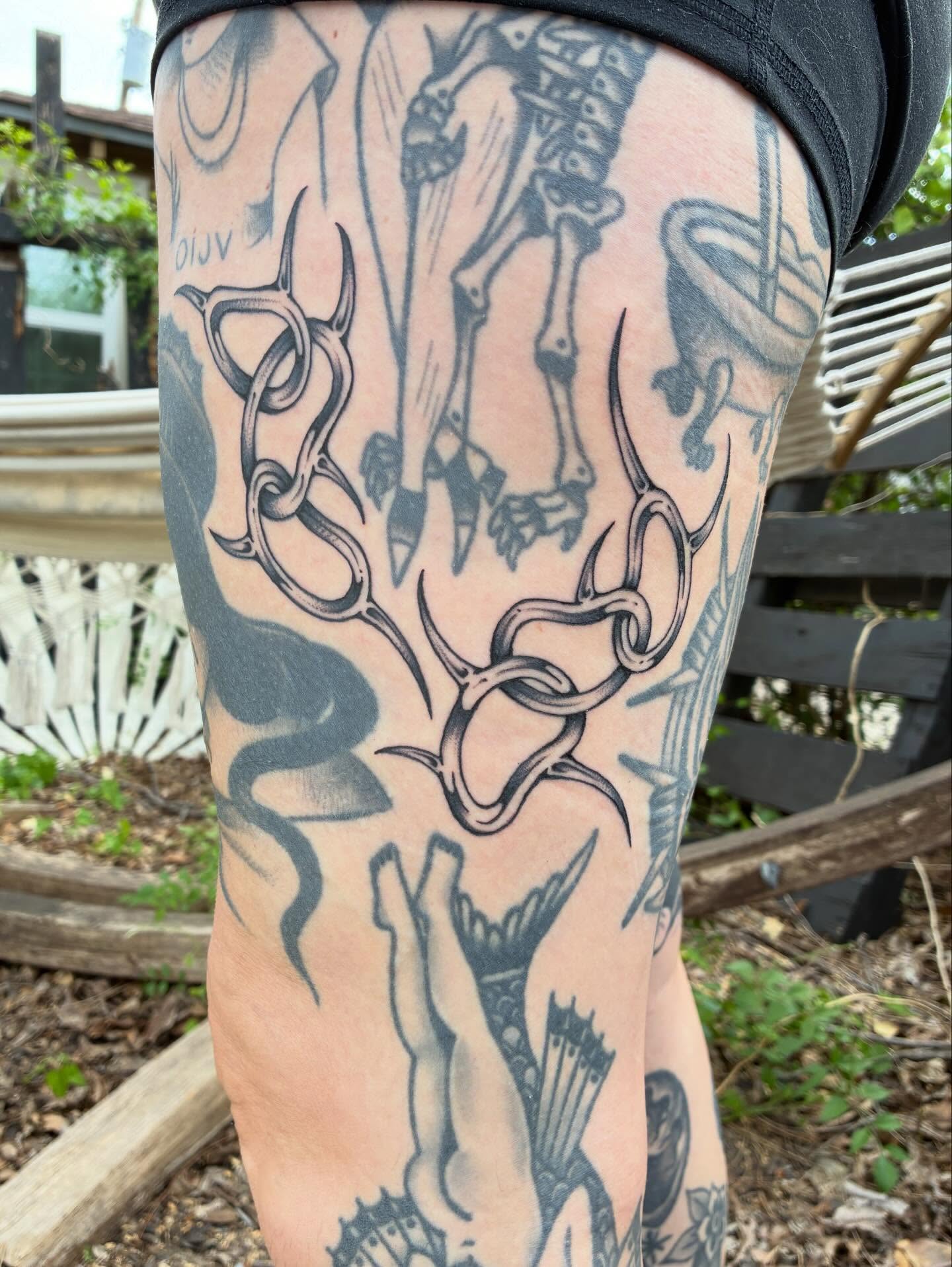 Antlers and skeleton black and grey tattoo on the thigh by Steven Sessler, San Francisco, California