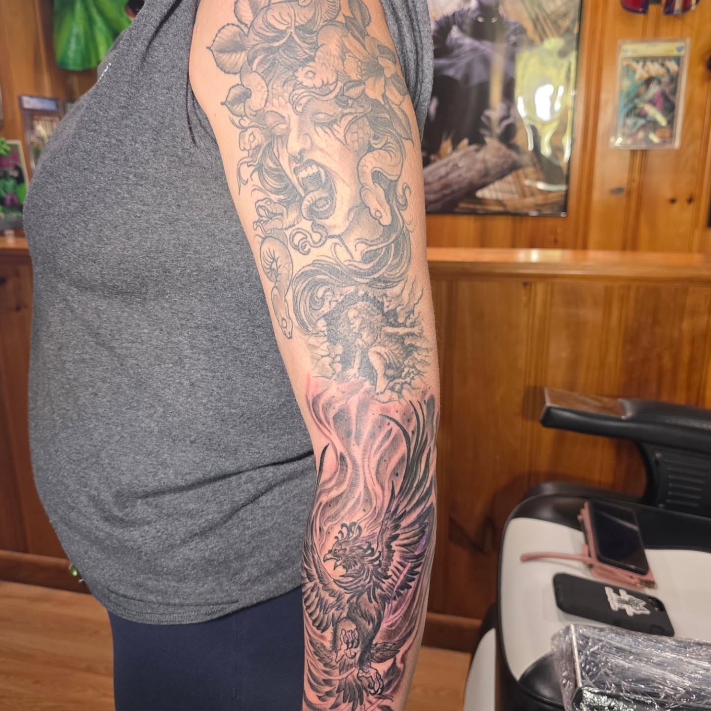Medusa and phoenix American traditional tattoo on the forearm by Rusty Williams