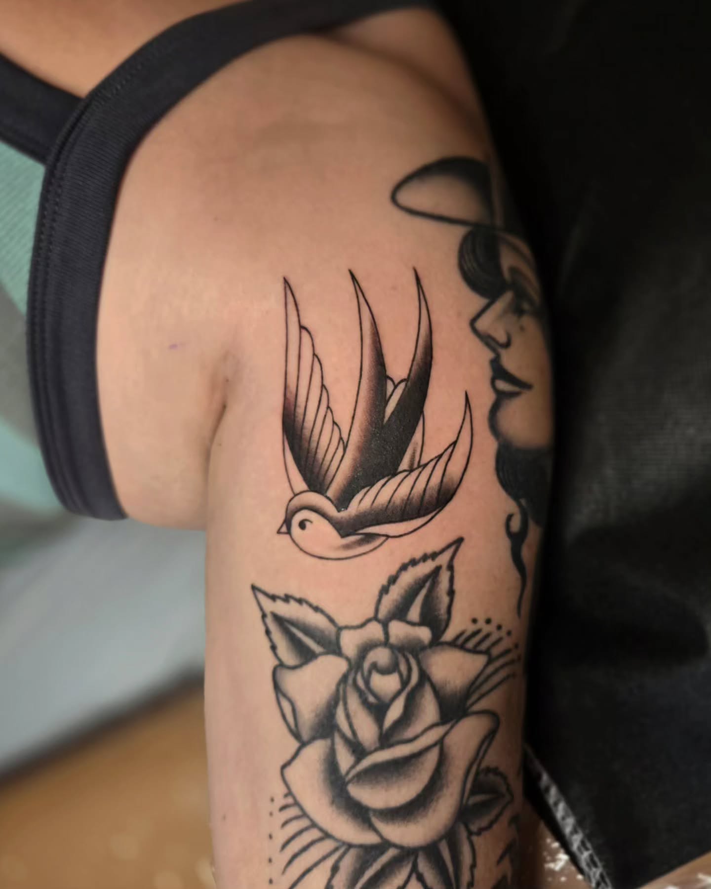 Swallow and rose black and grey tattoo on the forearm by jo(rdan)