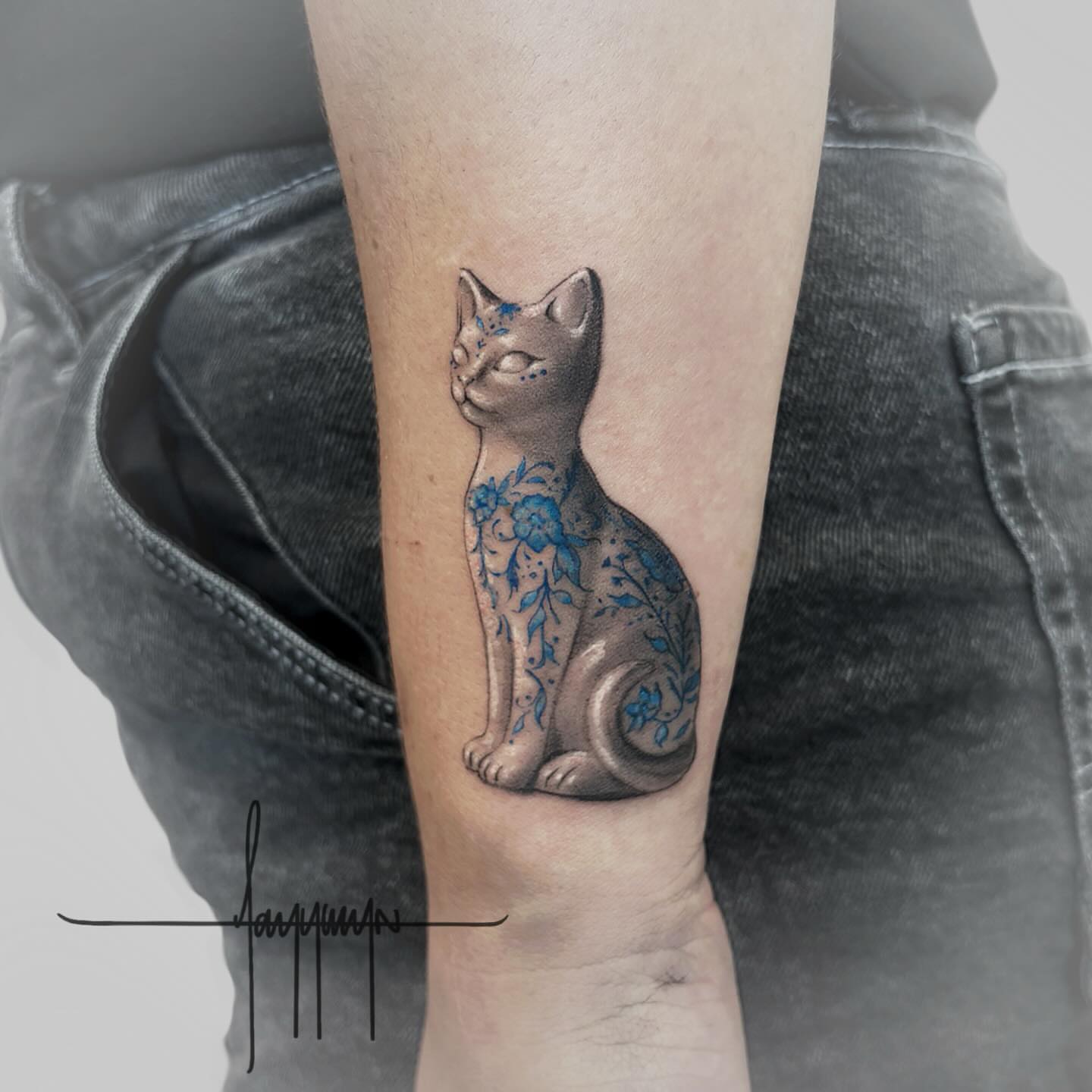 Cat realism tattoo on the forearm by Jazz