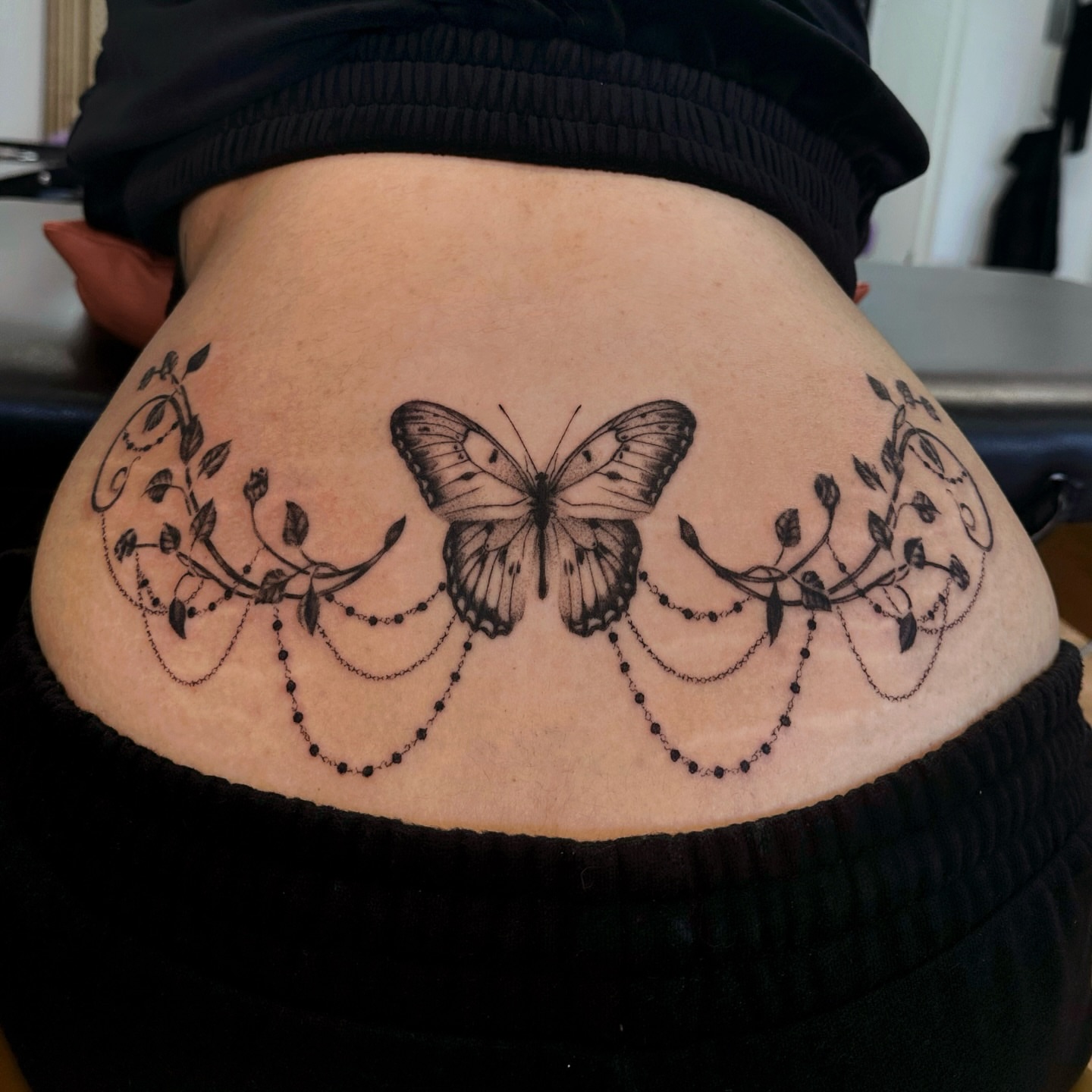 Butterfly black and grey tattoo on the thigh by kale