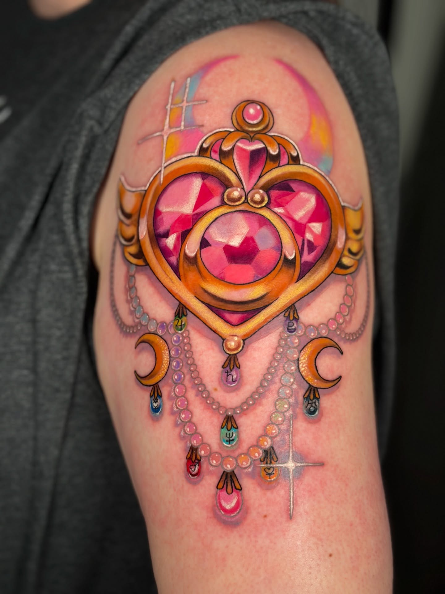 Heart-shaped pendant new school tattoo on the shoulder by Wendy Ruiz