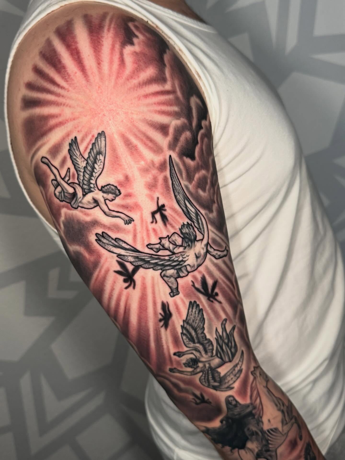 Cherubs and sunburst neo-traditional tattoo on the forearm by Las Vegas Tattoo Artist, Las Vegas, Nevada