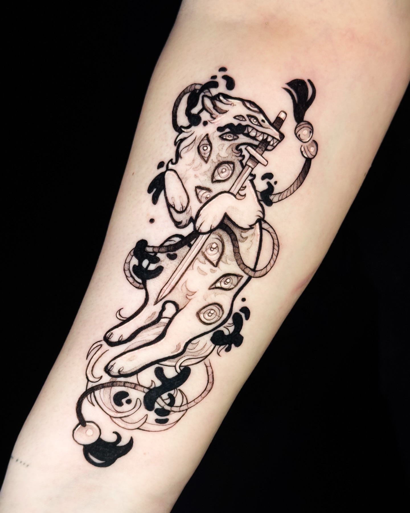 Lion and sword black and grey tattoo on the forearm by Yasemin πΉπ·π¬π§ San Jose based tattoo artist