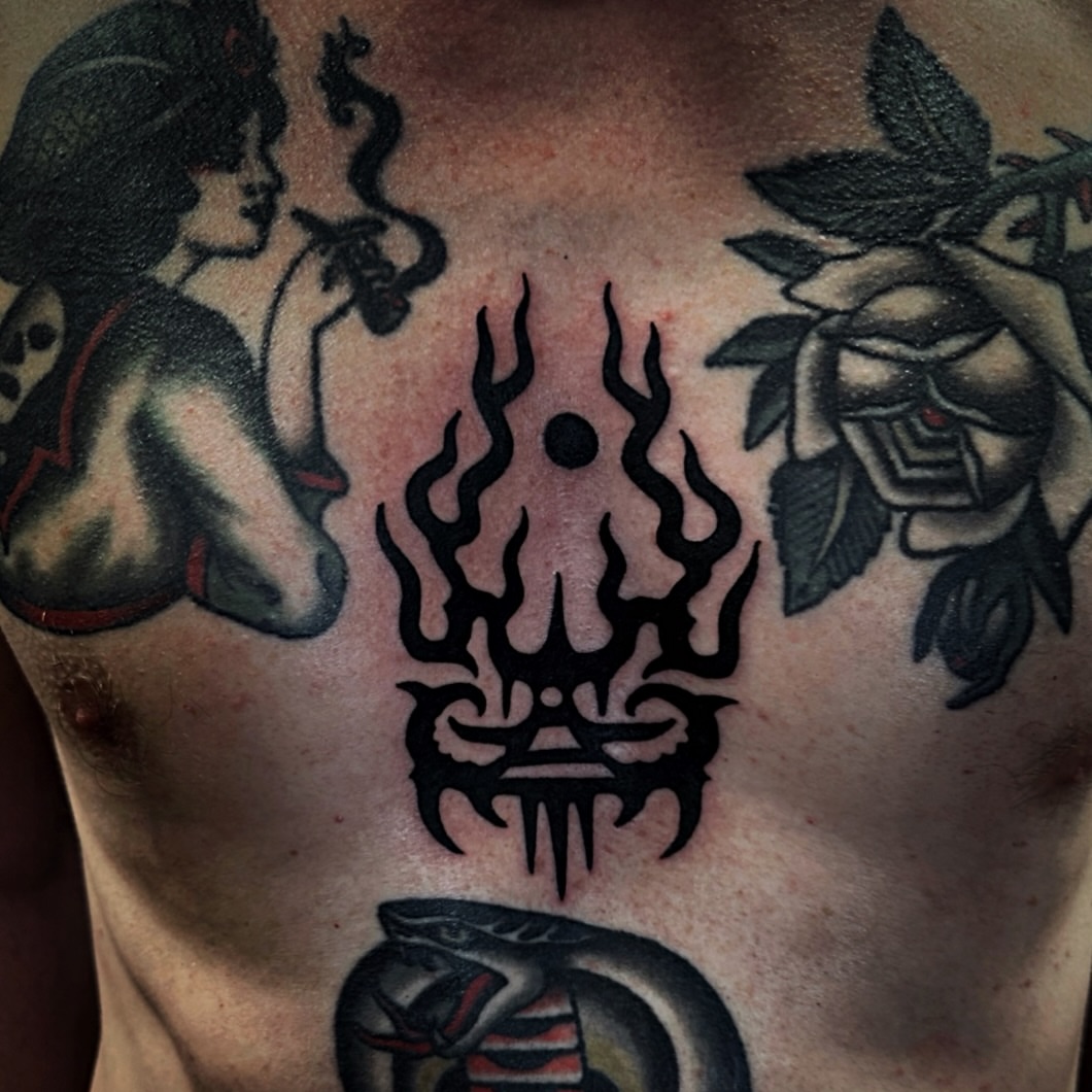 Tribal symbol tribal tattoo on the chest by Brandon Murphy