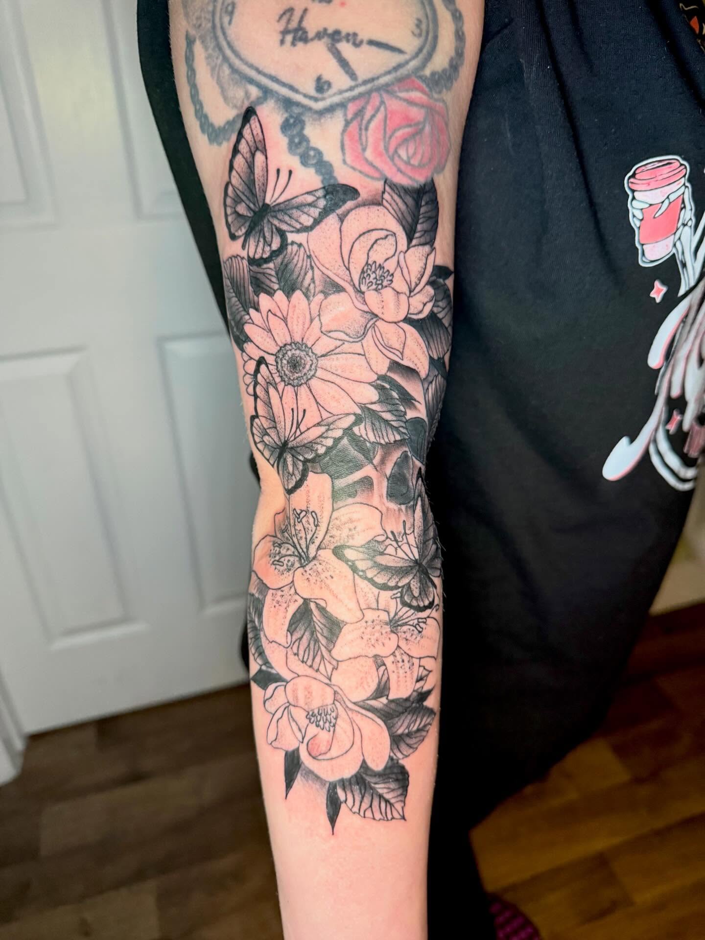 Flowers and butterflies black and grey tattoo on the forearm by Paul Calhoun Tattoos, Englewood, Ohio
