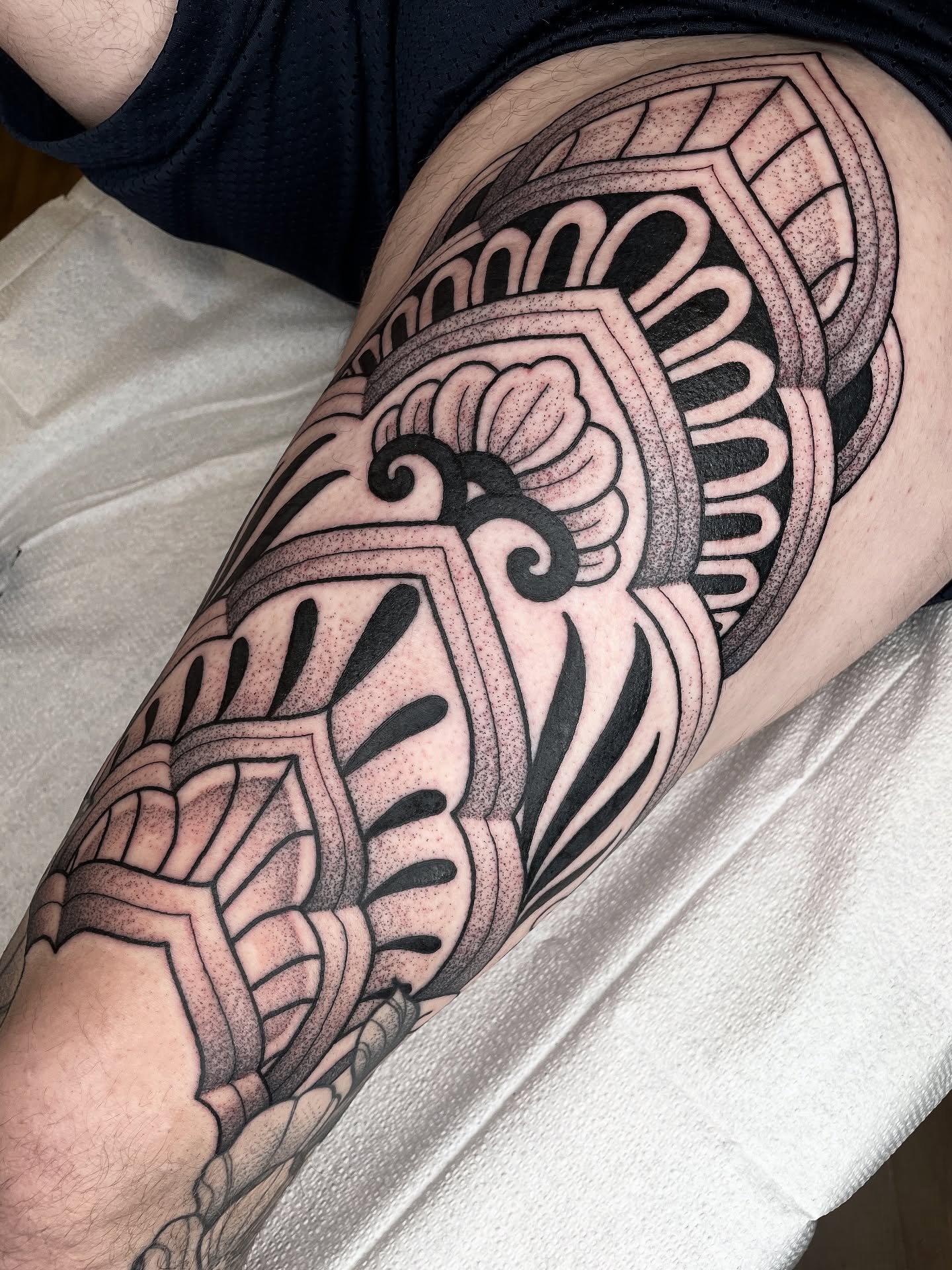 Geometric pattern dotwork tattoo on the thigh by Emily Lux