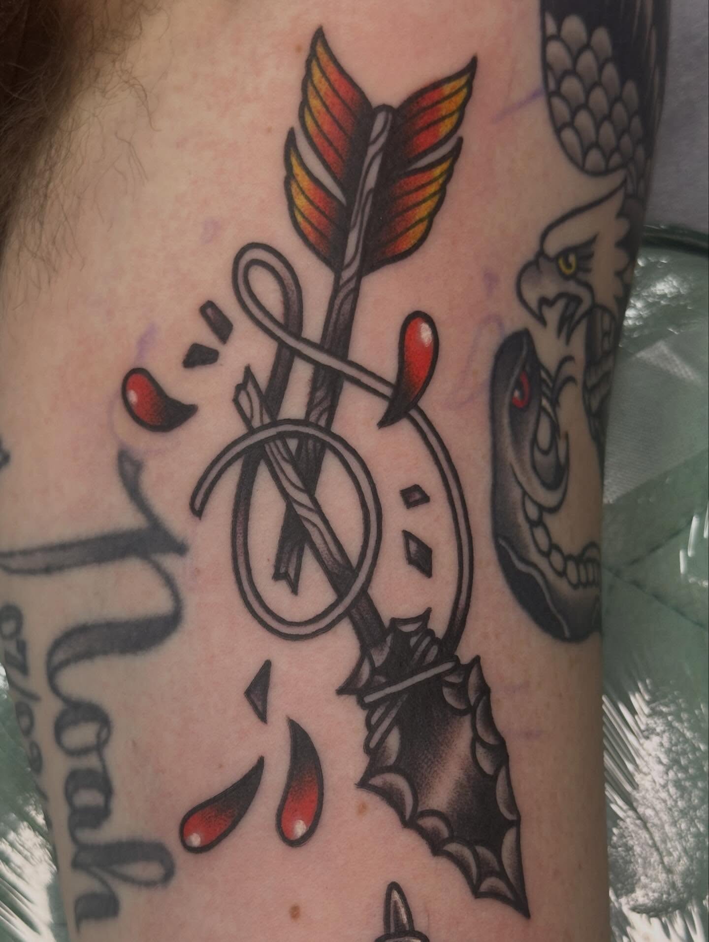 Arrow and heart American traditional tattoo on the forearm by Sammy Beresford