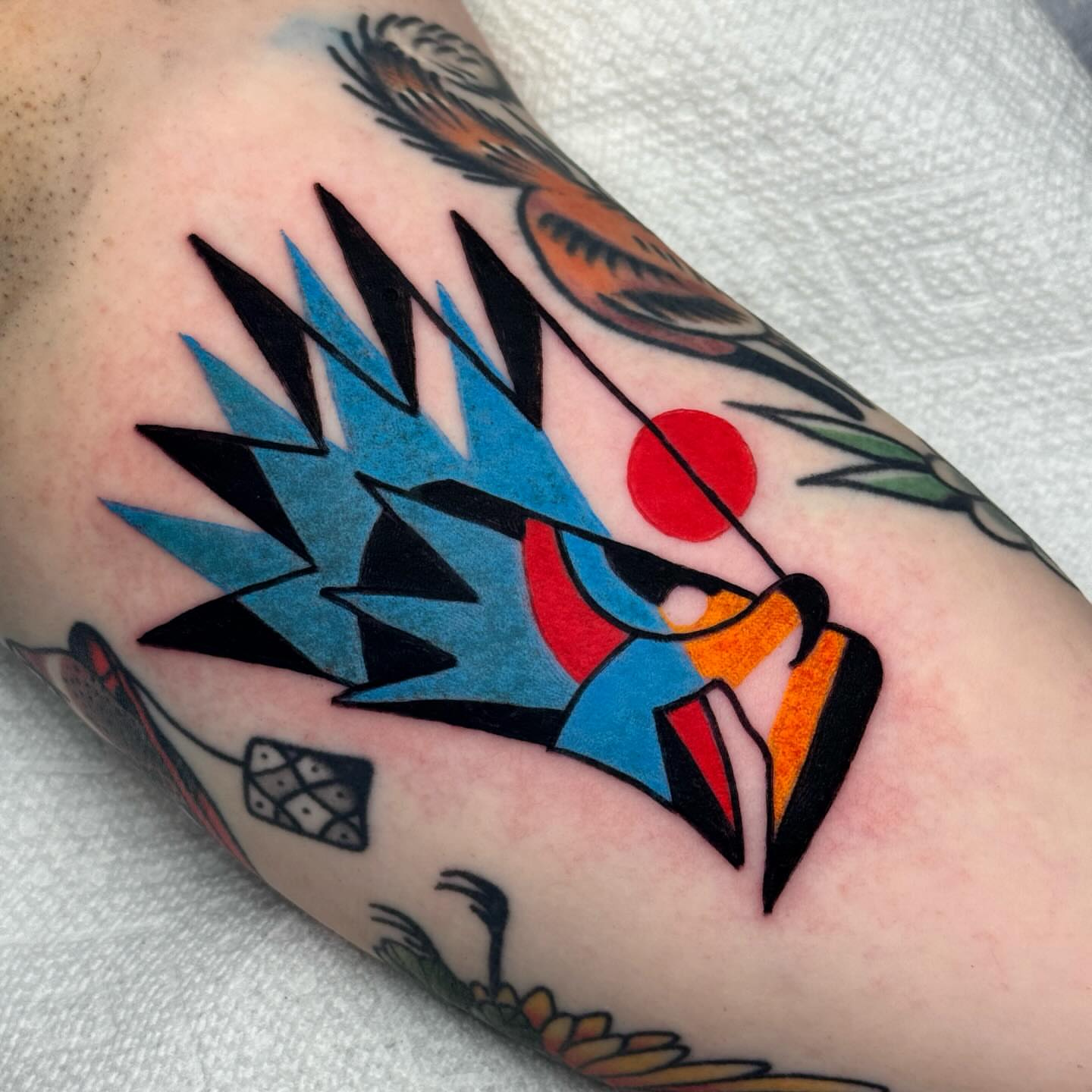 Bird American traditional tattoo on the forearm by Jess Baker