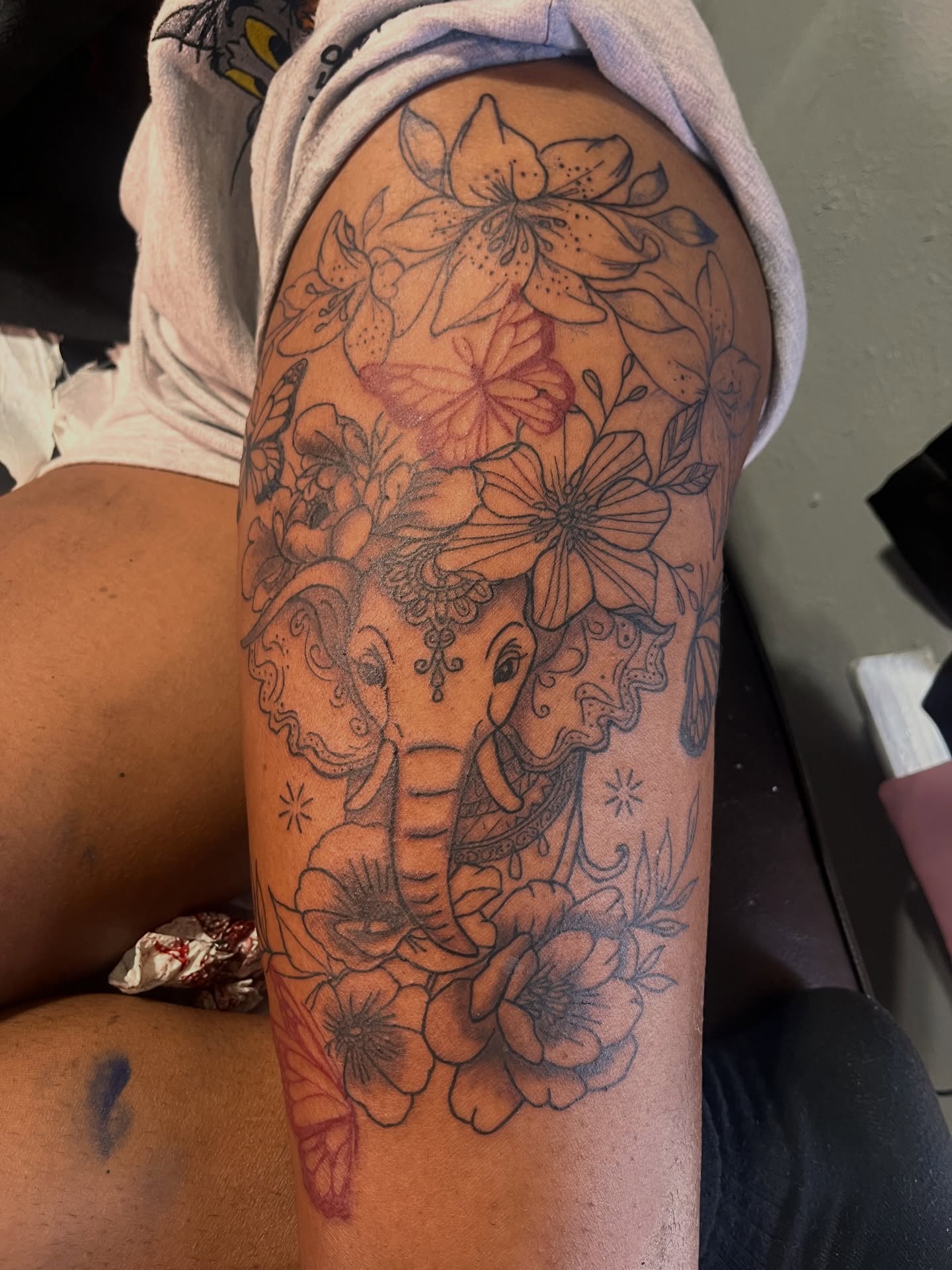 Elephant and floral black and grey tattoo on the thigh by The inspo