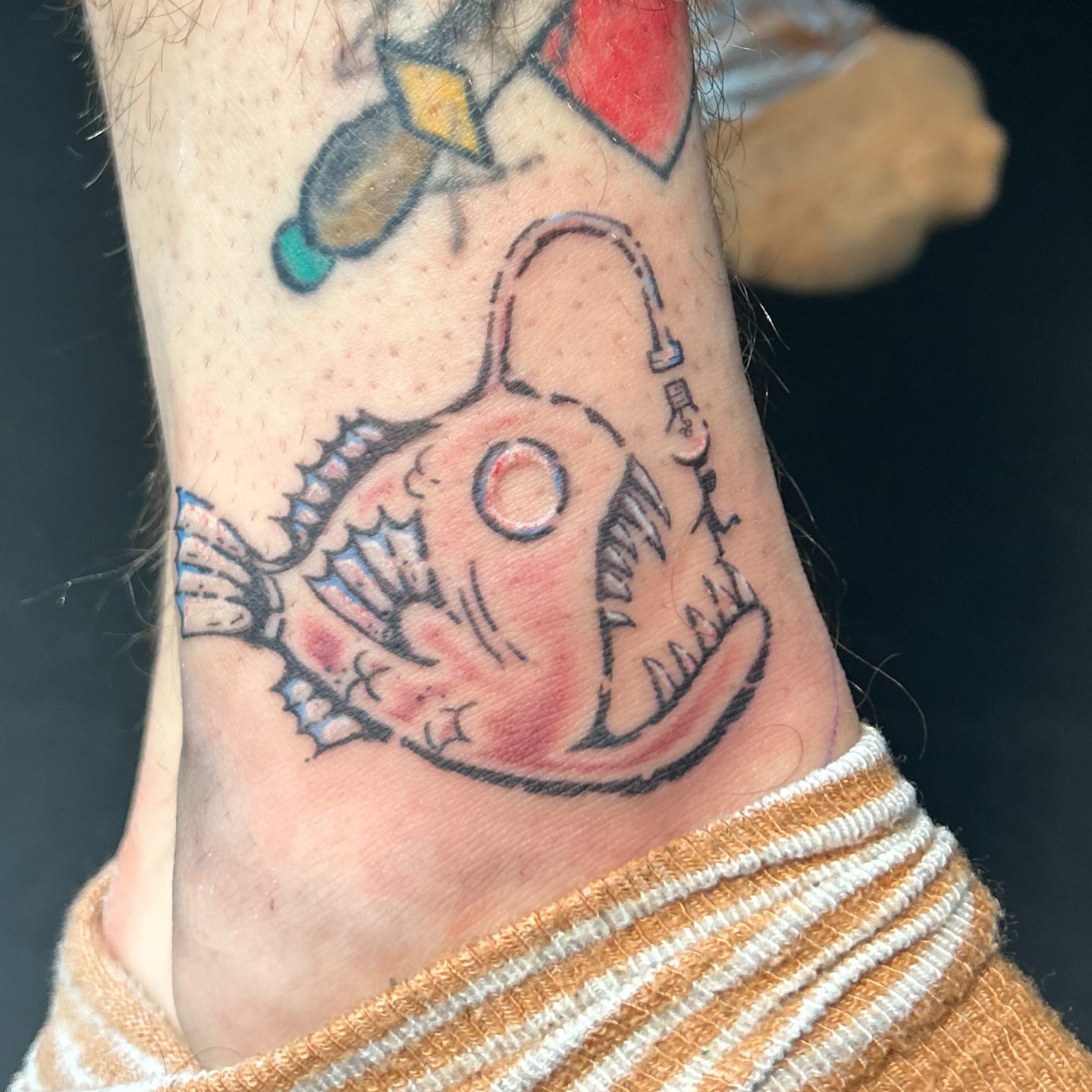 Angler fish American traditional tattoo on the forearm by Natalie Johnson, Minneapolis, Minnesota