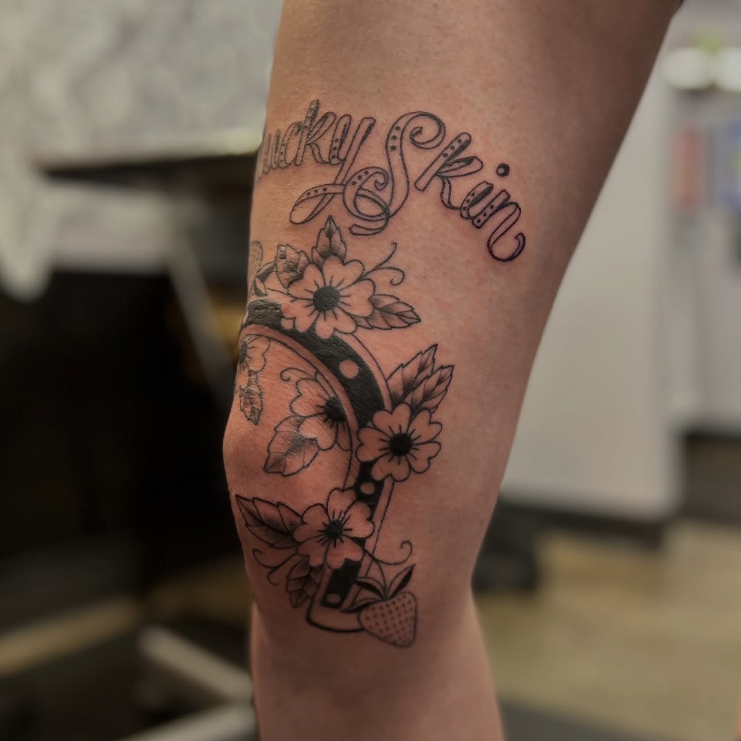 Flower and script black and grey tattoo on the forearm by Natalie Johnson, Minneapolis, Minnesota
