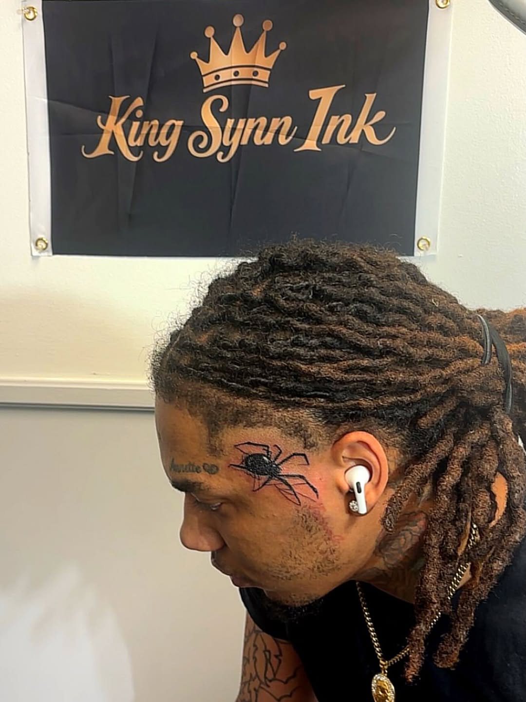 Spider on face tattoo on the head by Syneca Wilson, Acton, Massachusetts