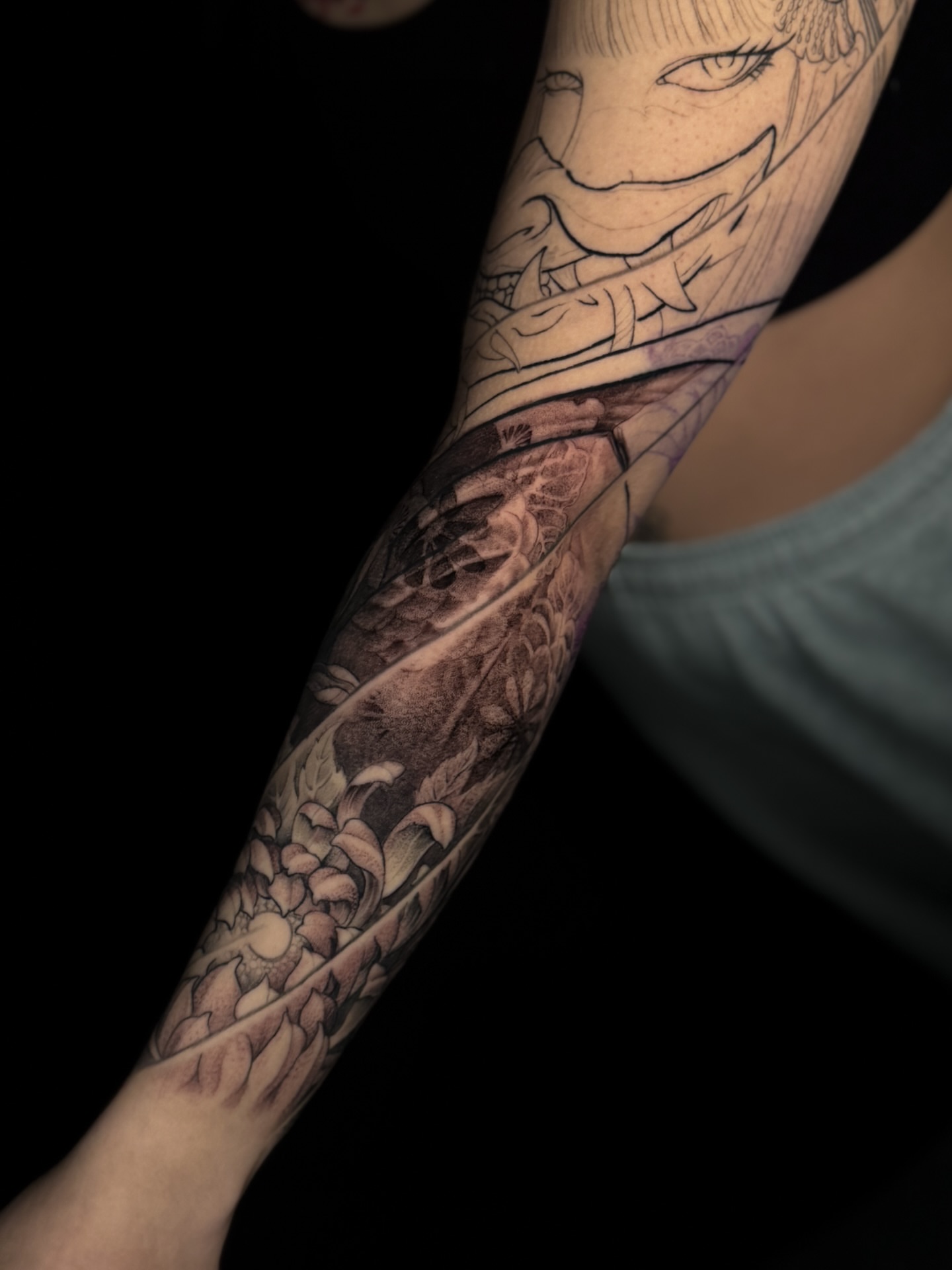 Anime character with floral background anime tattoo on the forearm by Vince Lau