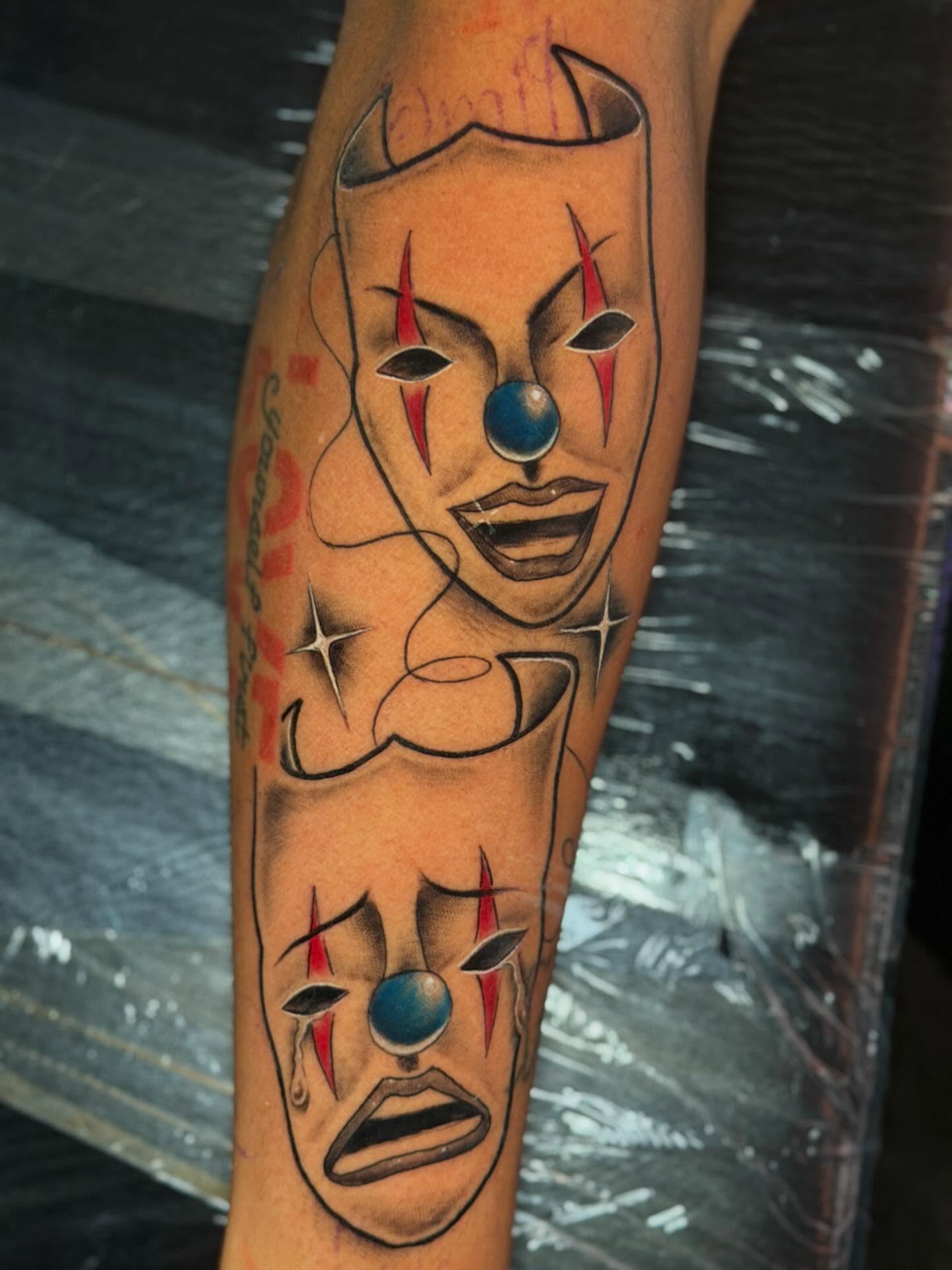 Clown faces geometric tattoo on the forearm by Dany