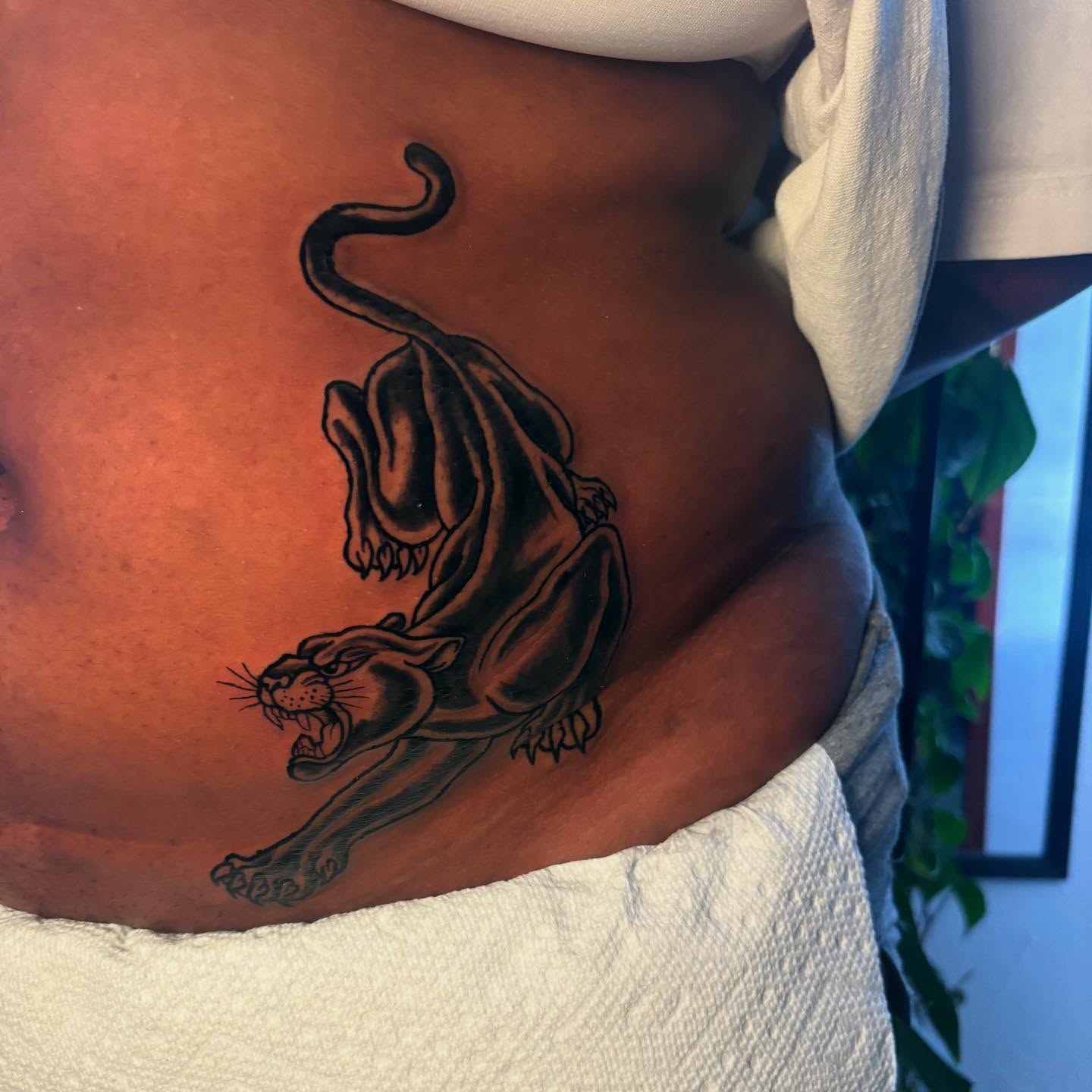 Panther black and grey tattoo on the torso by D. Davis