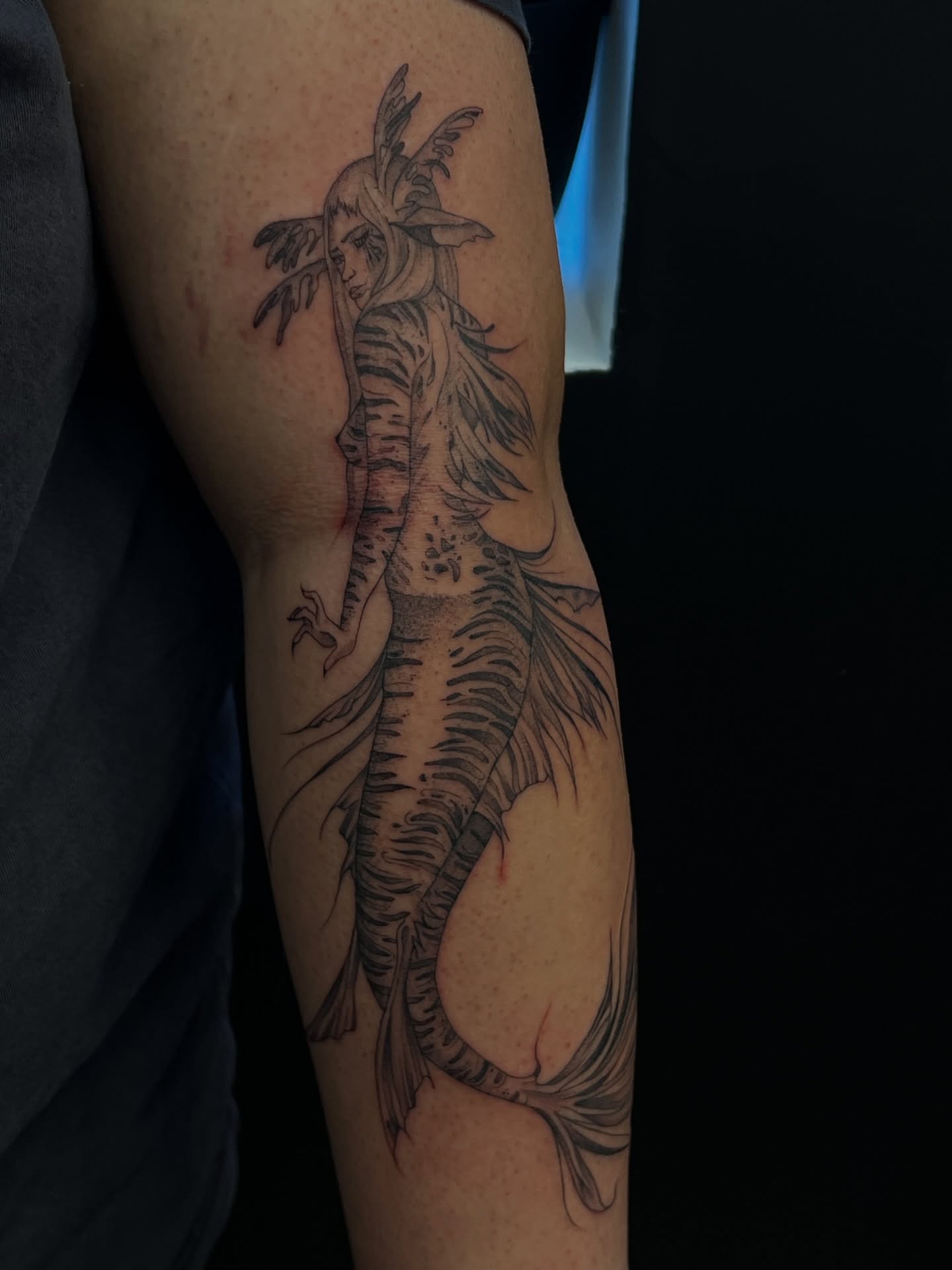 Mermaid black and grey tattoo on the forearm by ashlyn rene
