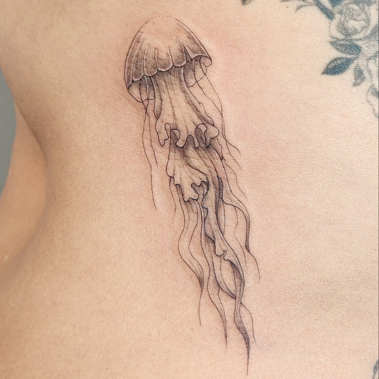 Jellyfish black and grey tattoo on the ribs by Tattoo artist - Luciana Dsilva, San Francisco, California