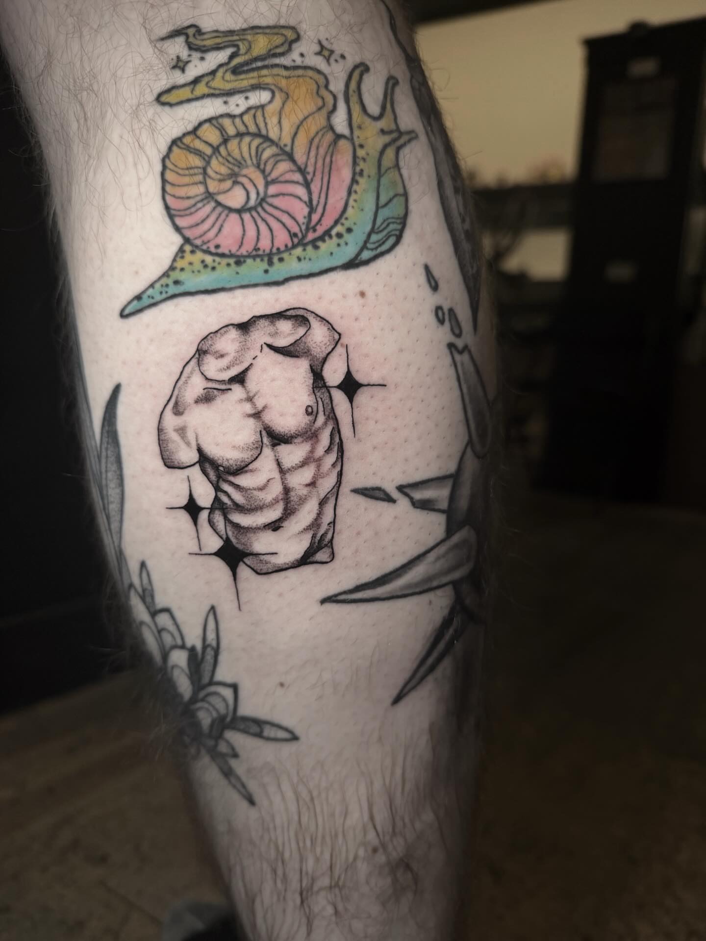 Muscle and snail realism tattoo on the forearm by Jess, Midvale, Utah