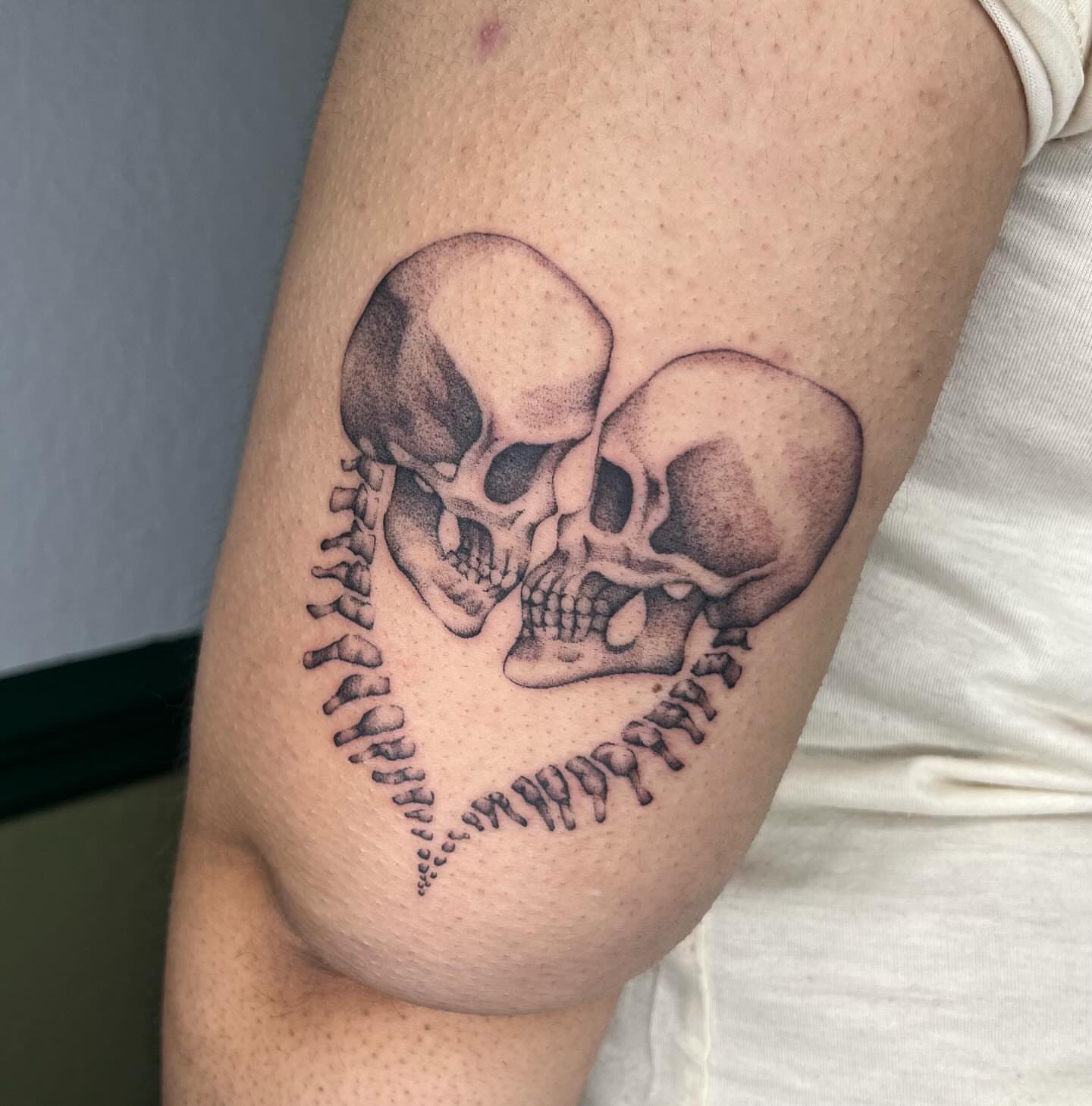 Skulls dotwork tattoo on the thigh by Ash F