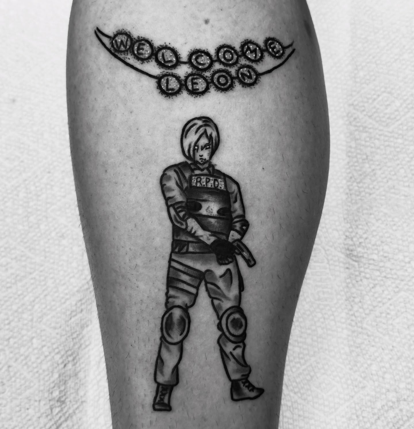 Leon Kennedy black and grey tattoo on the leg by Brandon