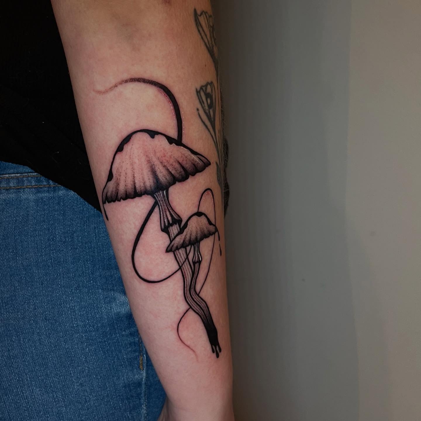 Mushroom black and grey tattoo on the forearm by Elisa