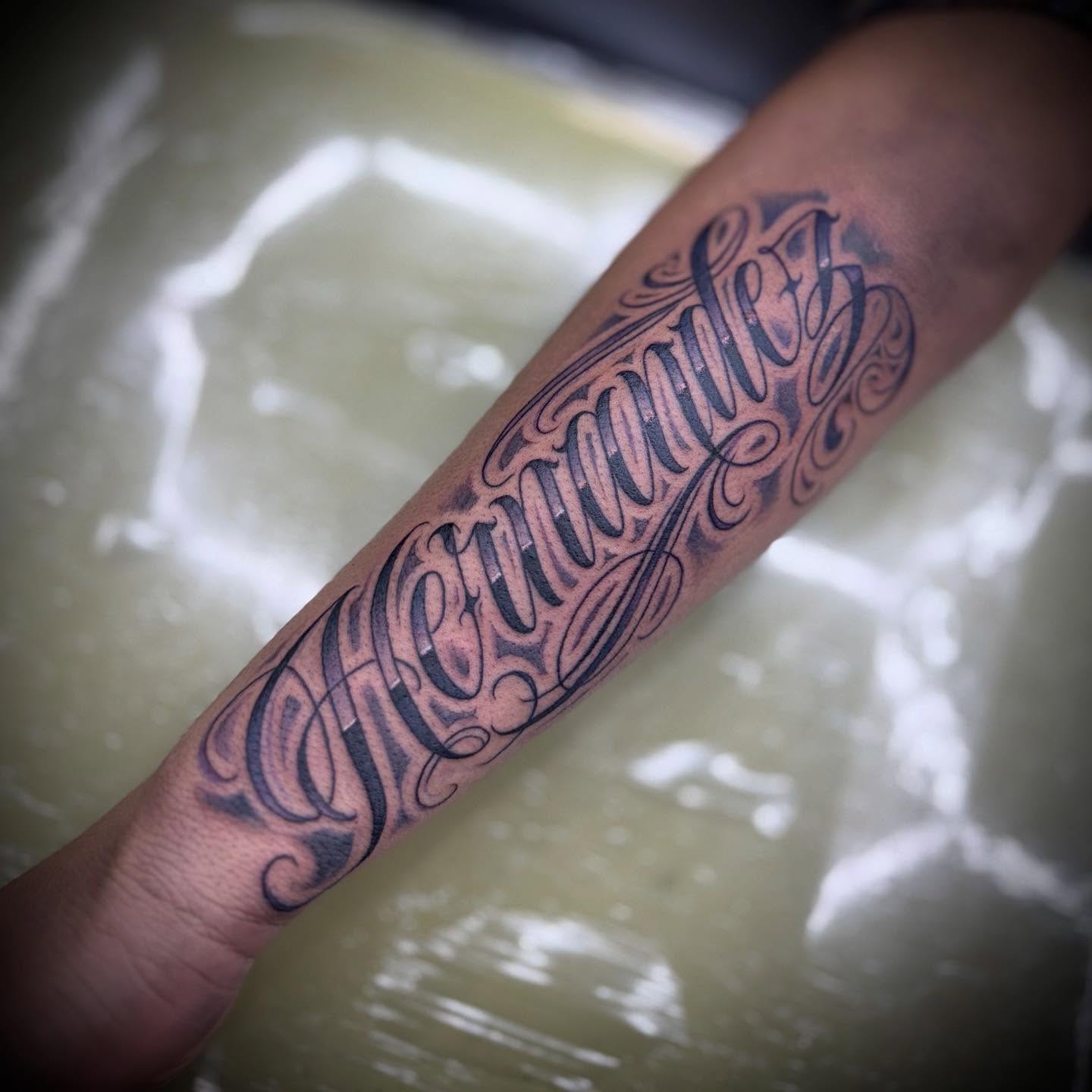 Tattoo by @inkbychuy — lettering_script, ornamental