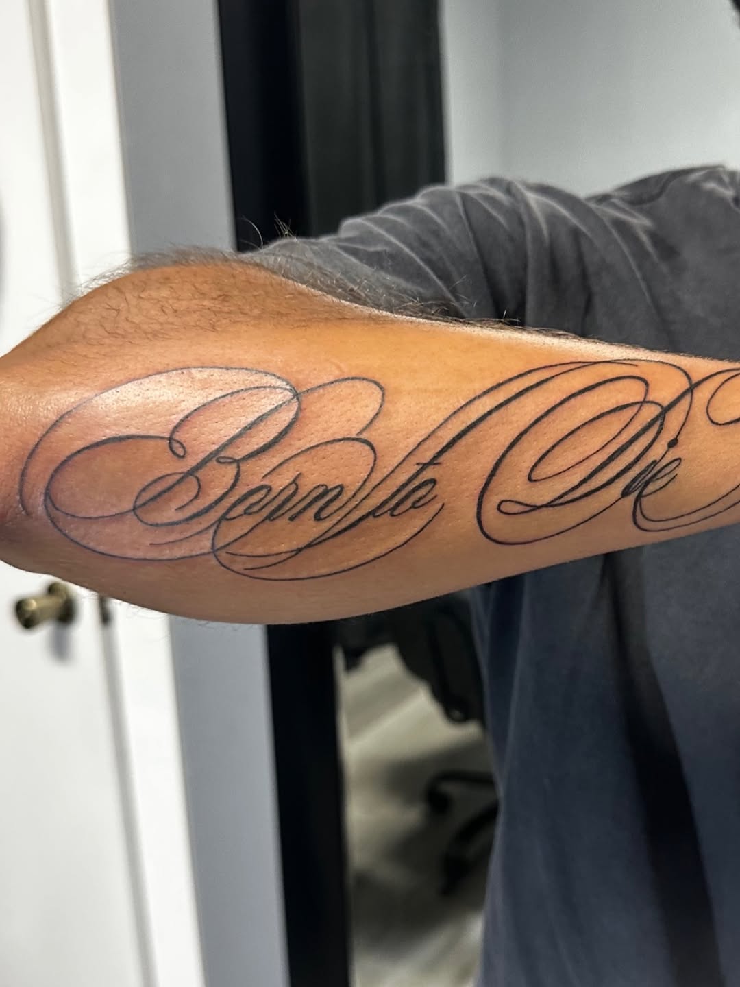 Born to Die script lettering tattoo on the forearm by Lupita Ink