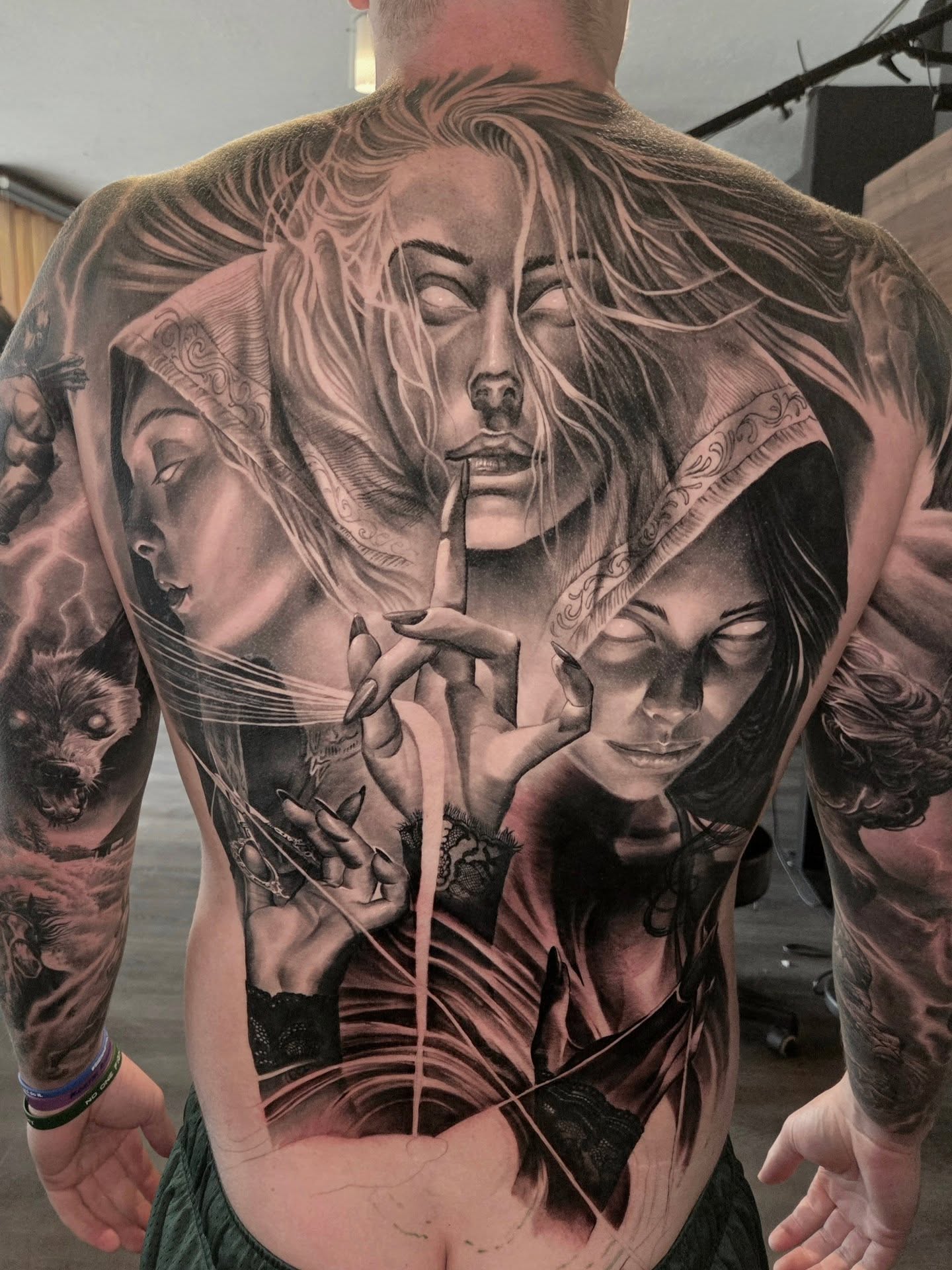 Three women realism tattoo on the back by Preston