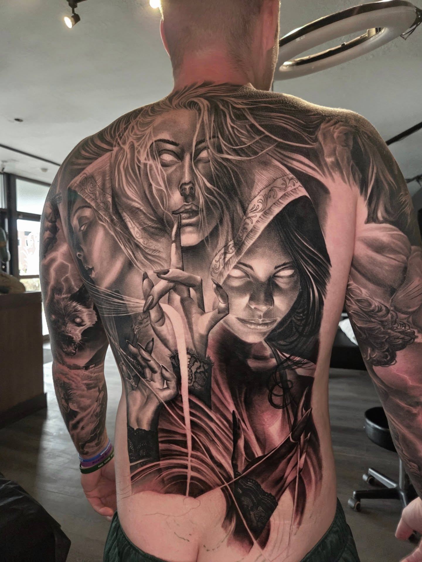 Two women realism tattoo on the back by Preston