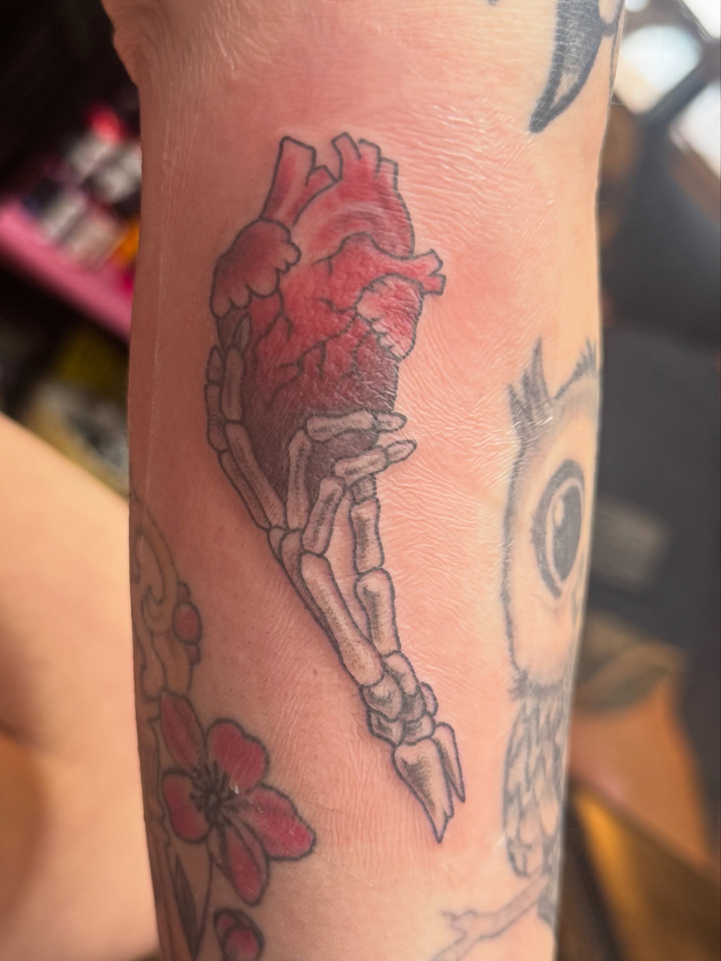 Heart and skeleton neo-traditional tattoo on the forearm by Teagan Rachel, Millcreek, Utah